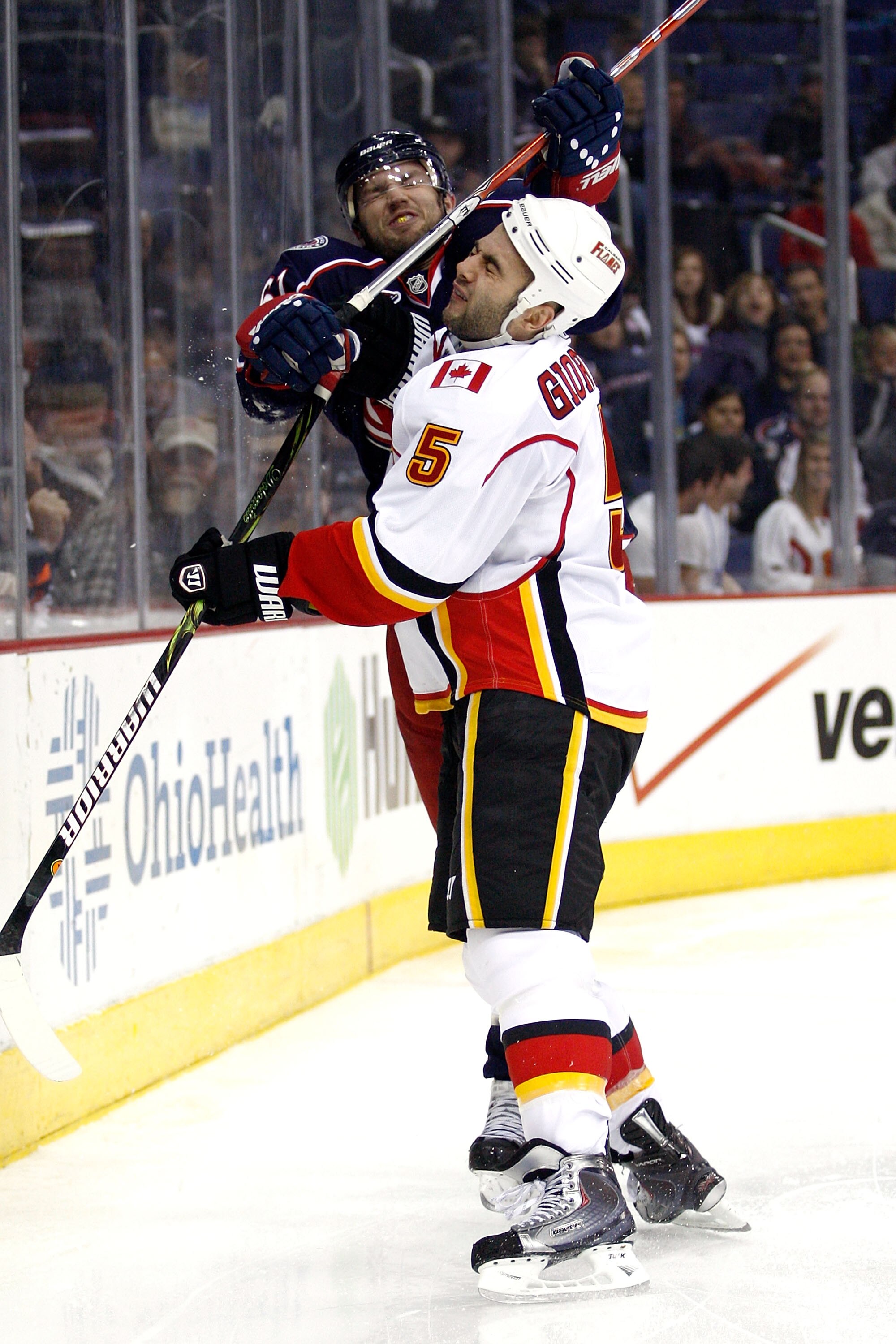 COLUMBUS, OH - OCTOBER 22:  Rick Nash #61 of the Columbus Blue Jackets gets called for high-sticking after hitting Mark Giordano #5 of the Calgary Flames during the second period on October 22, 2010 at Nationwide Arena in Columbus, Ohio.  (Photo by John G