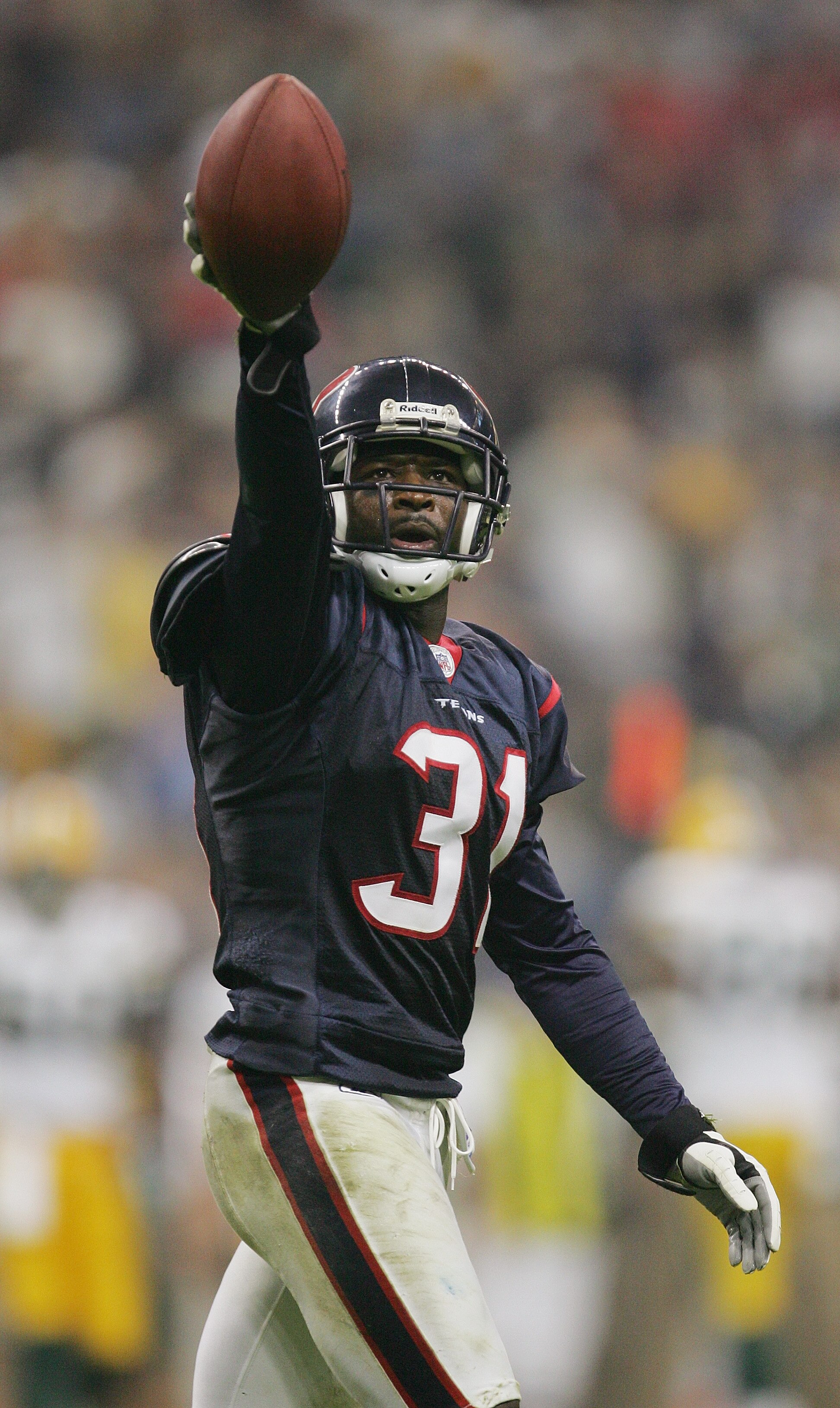 HOUSTON - NOVEMBER 21:  Cornerback Aaron Glenn #31 of the Houston Texans looks on against the Green Bay Packers on November 21, 2004 at Reliant Stadium in Houston, Texas.   The Packers defeated the Texans 16-13.  (Photo by Ronald Martinez/Getty Images)