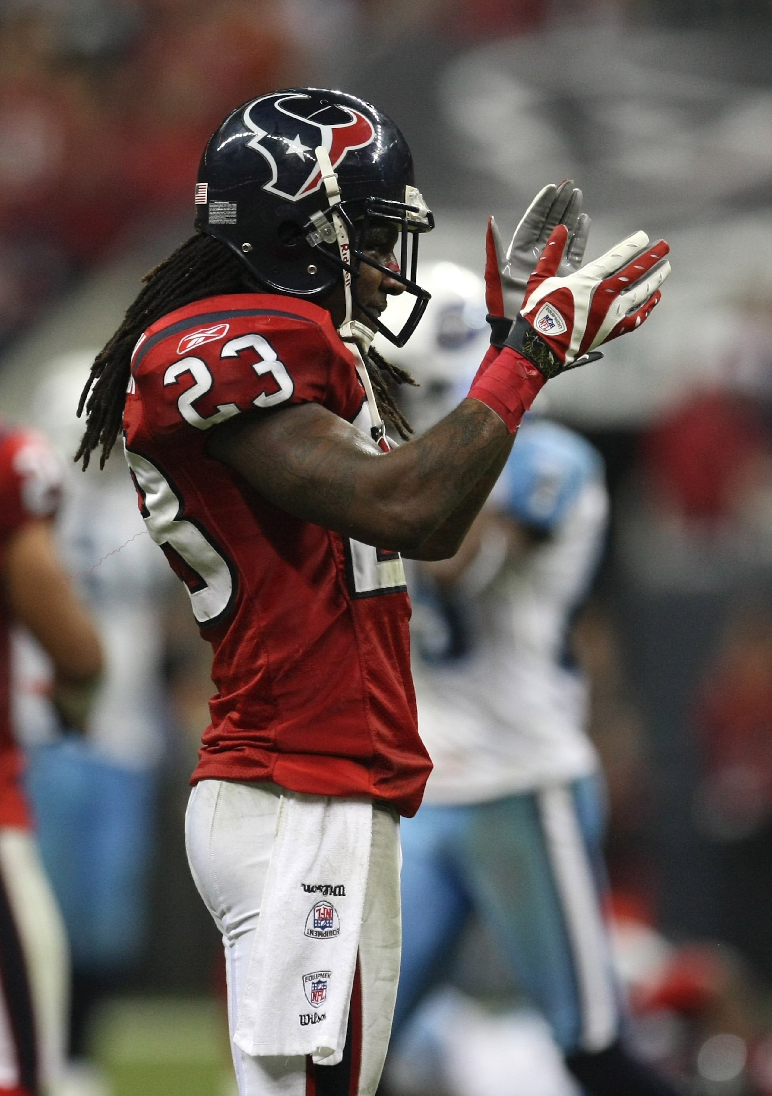 HOUSTON - NOVEMBER 23:  Cornerback Dunta Robinson #23 of the Houston Texans celebrates in the game against the Tennessee Titans on November 23, 2009  at Reliant Stadium in Houston, Texas.  The Titans won 20-17.  (Photo by Stephen Dunn/Getty Images)