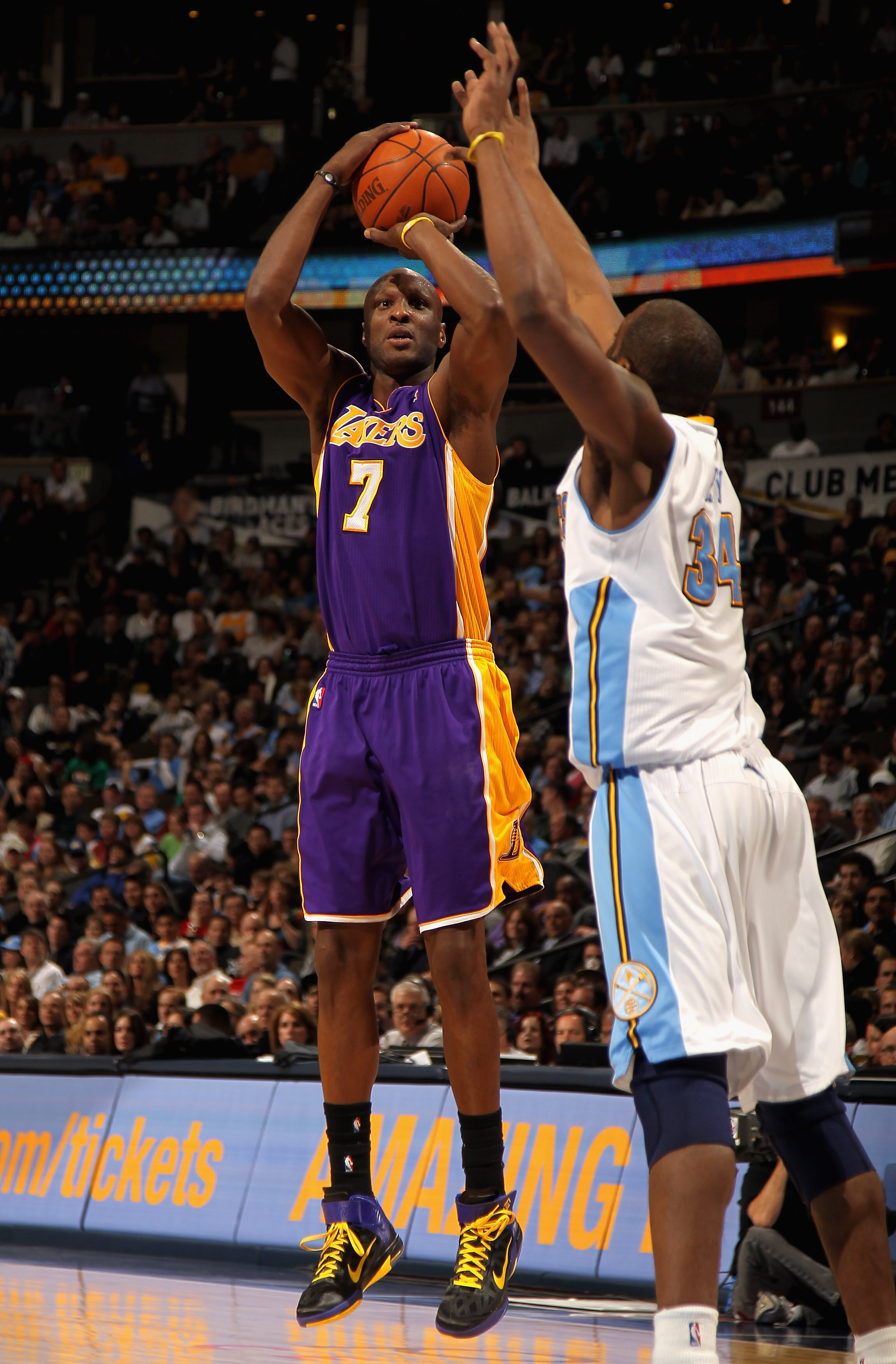 DENVER, CO - JANUARY 21:  Lamar Odom #7 of the Los Angeles Lakers takes a shot against Melvin Ely #34 of the Denver Nuggets at the Pepsi Center on January 21, 2011 in Denver, Colorado. NOTE TO USER: User expressly acknowledges and agrees that, by download