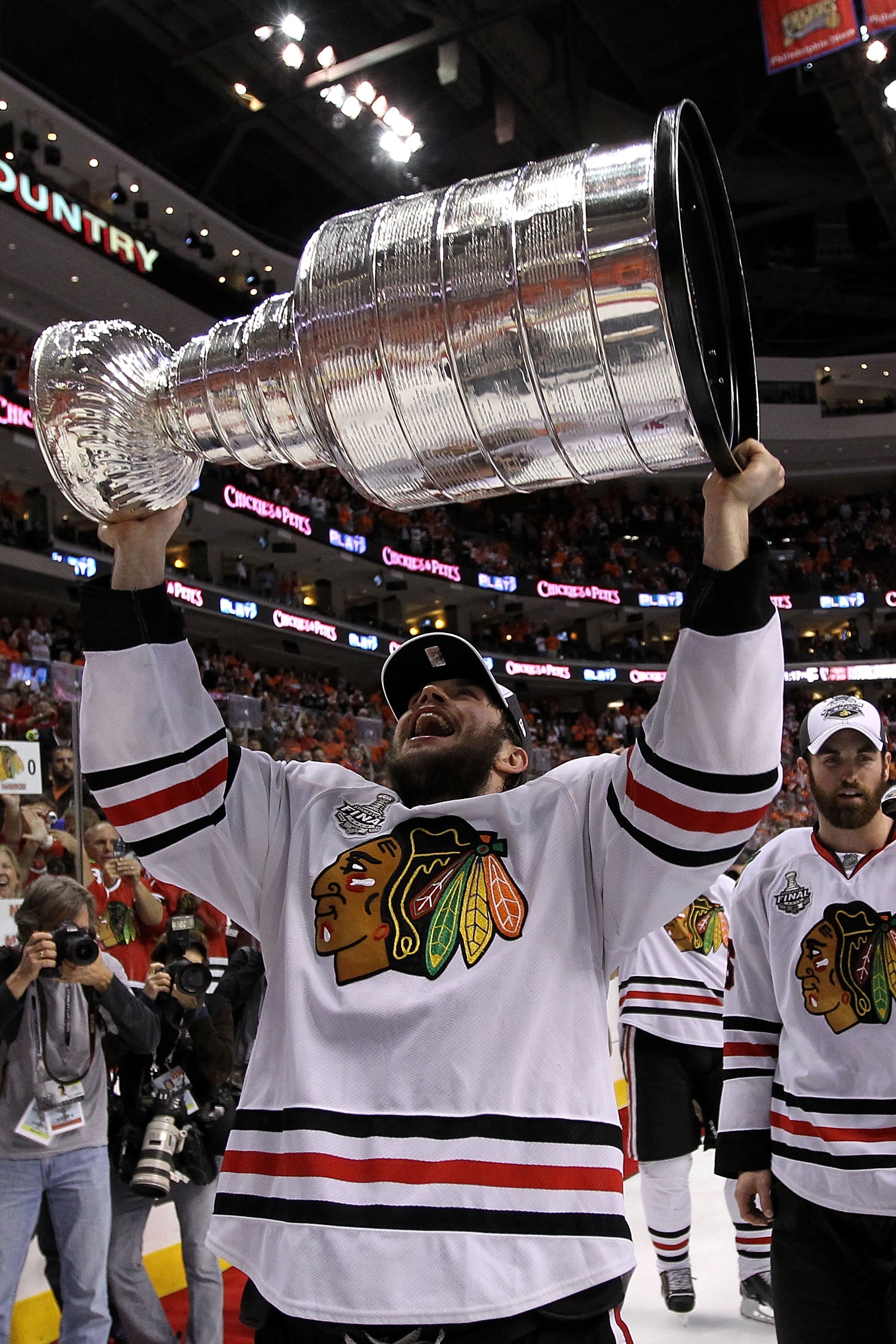 PHILADELPHIA - JUNE 09:  Dave Bolland #36 of the Chicago Blackhawks hoists the Stanley Cup after teammate Patrick Kane #88 scored the game-winning goal in overtime to defeat the Philadelphia Flyers 4-3 and win the Stanley Cup in Game Six of the 2010 NHL S