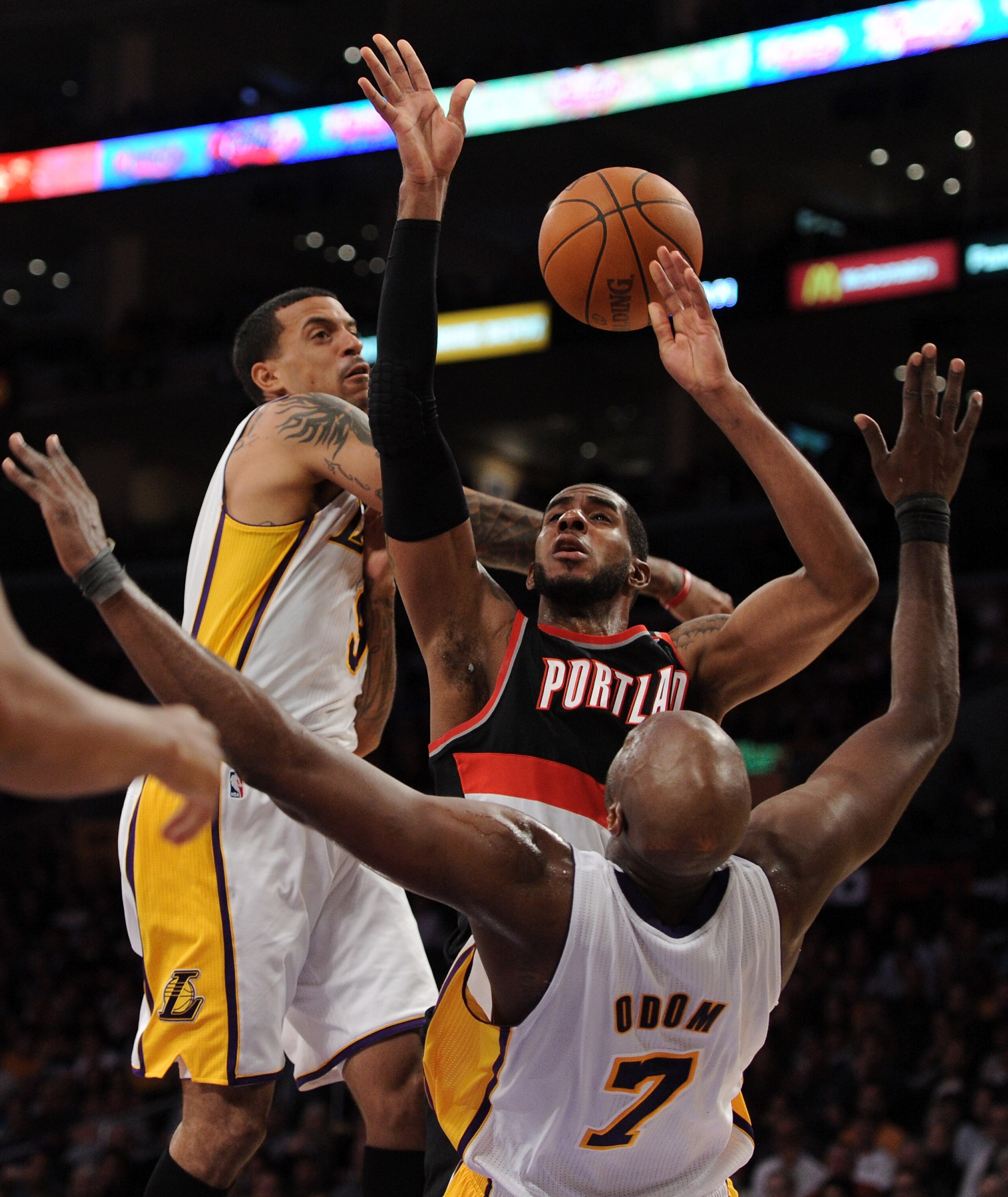 LOS ANGELES, CA - NOVEMBER 07:  LaMarcus Aldridge #12 of the Portland Trail Blazers has the ball knocked away by Matt Barnes #9 and Lamar Odum #7 of the Los Angeles Lakers during a 121-96 loss at the Staples Center on November 7, 2010 in Los Angeles, Cali