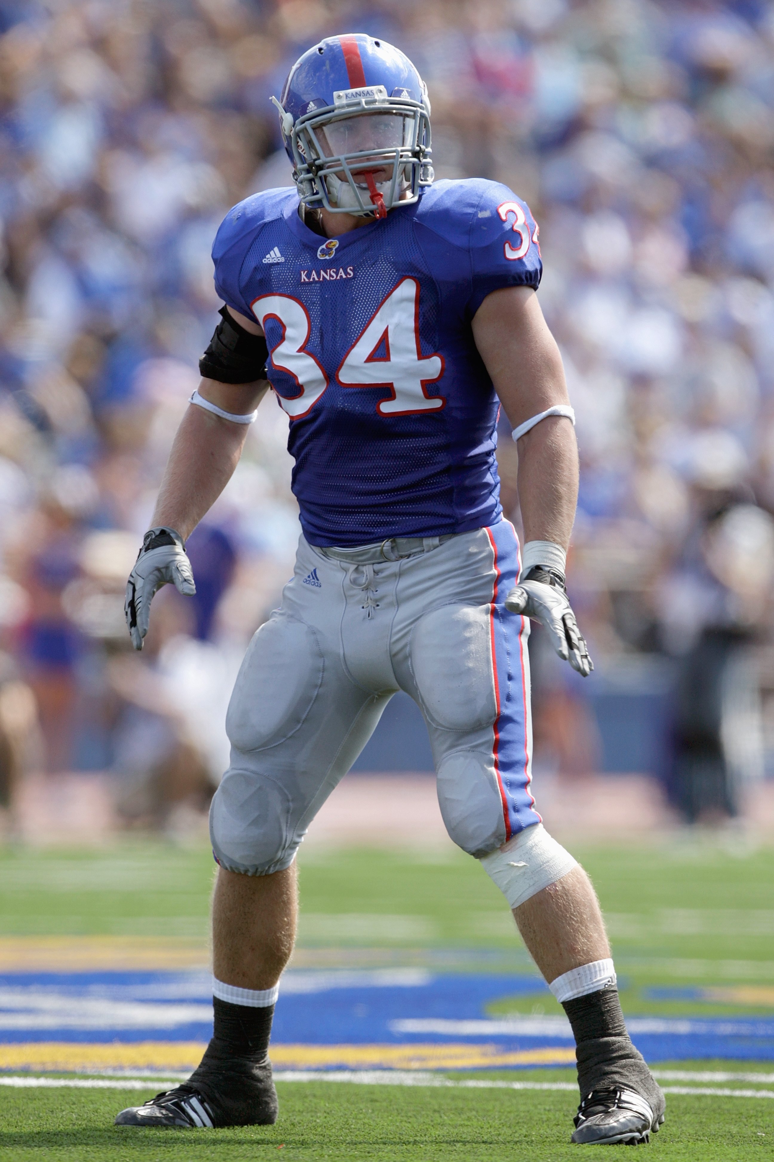 LAWRENCE, KS - SEPTEMBER 19:  Linebacker Huldon Tharp #34 of the Kansas Jayhawks gets ready on the line during the game against the Duke Blue Devils on Kivisto Field at Memorial Stadium on September 19, 2009 in Lawrence, Kansas. (Photo by Jamie Squire/Get