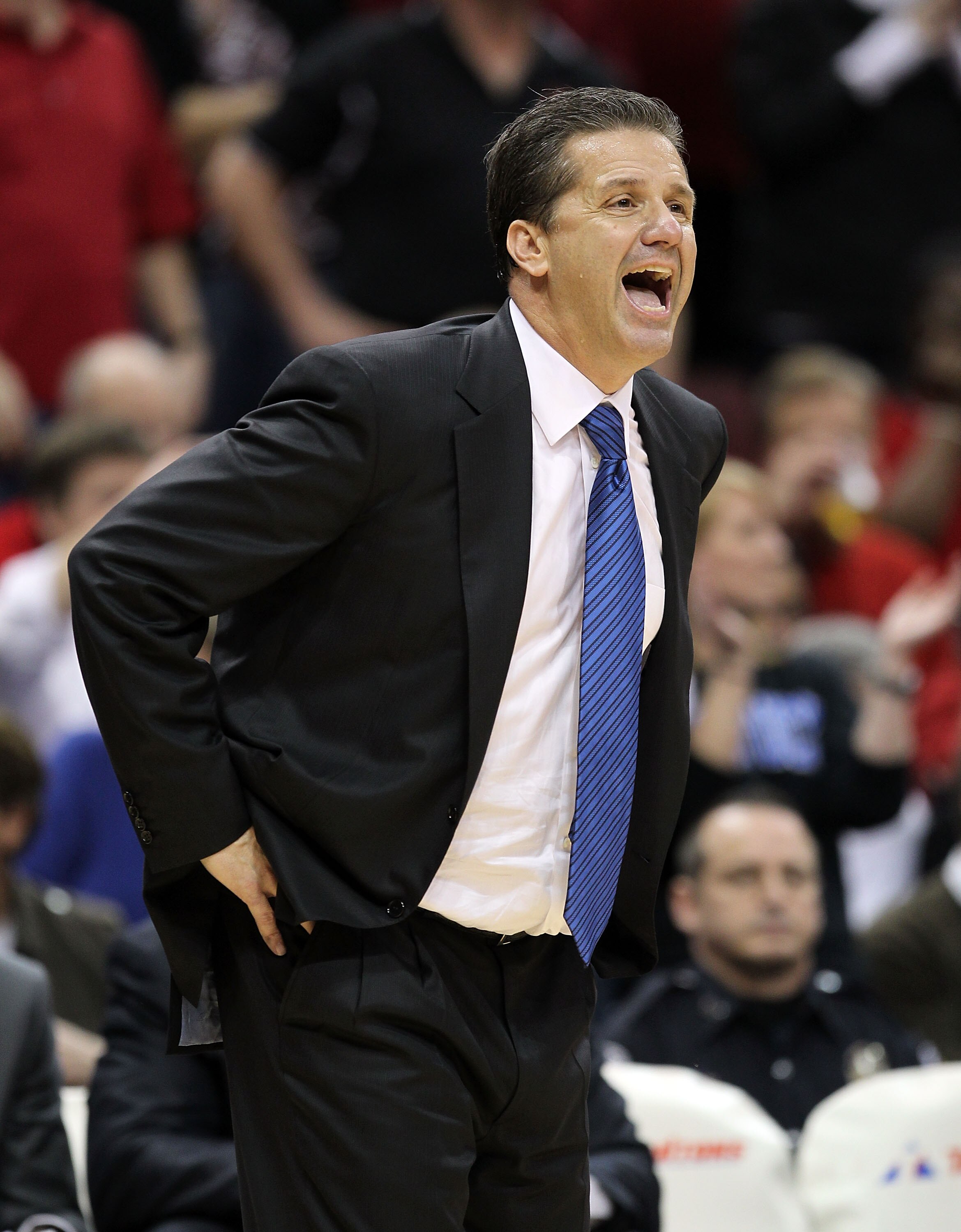 LOUISVILLE, KY - DECEMBER 31:  John Calipari the Head Coach of the Kentucky Wildcats gives instructions to his team during the game against the Louisville Cardinals at the KFC Yum! Center on December 31, 2010 in Louisville, Kentucky. Kentucky won 78-63. (
