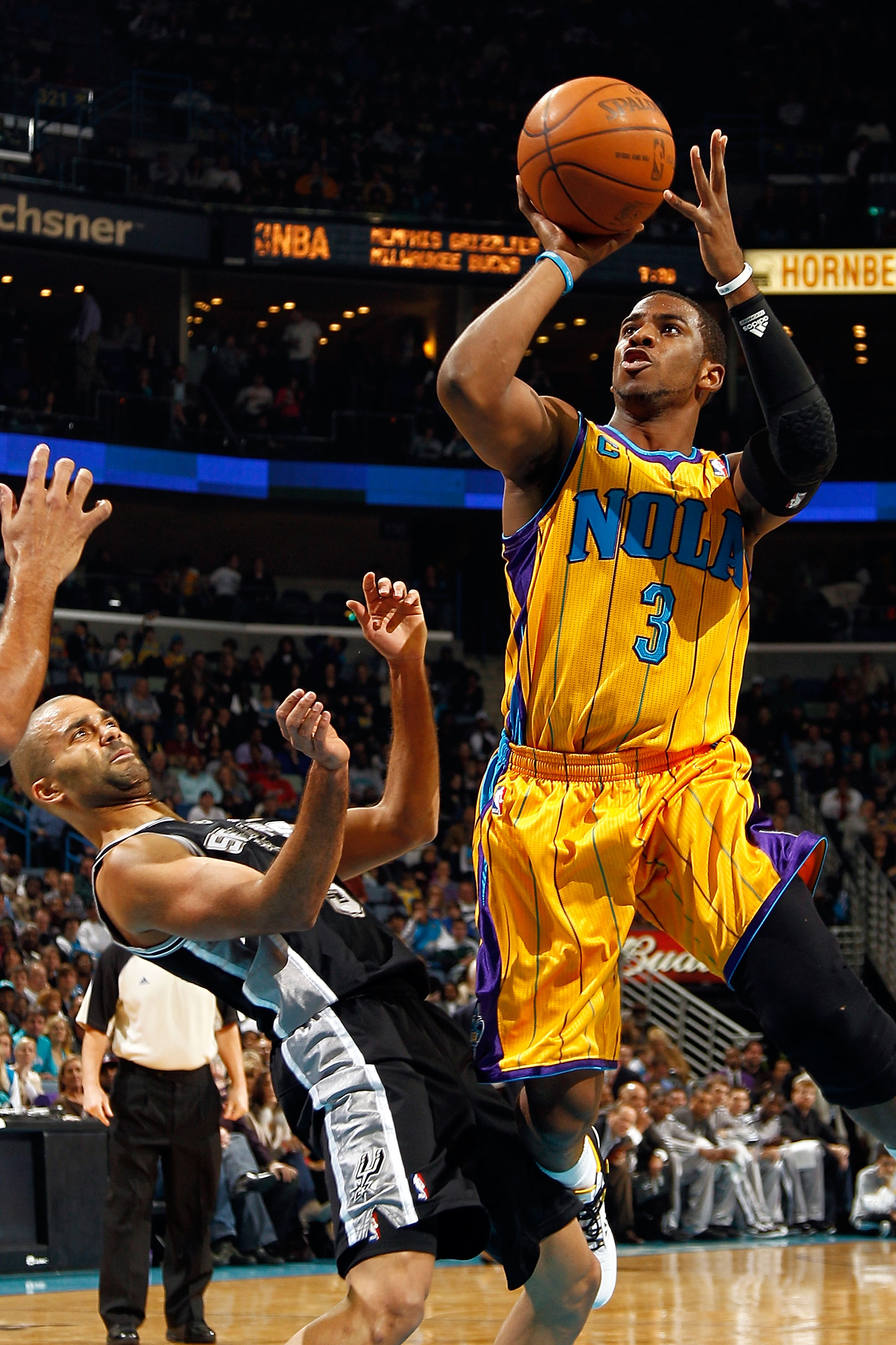 NEW ORLEANS, LA - JANUARY 22:  Chris Paul #3 of the New Orleans Hornets shoots the ball over Tony Parker #9 of the San Antonio Spurs at the New Orleans Arena on January 22, 2011 in New Orleans, Louisiana.  NOTE TO USER: User expressly acknowledges and agr
