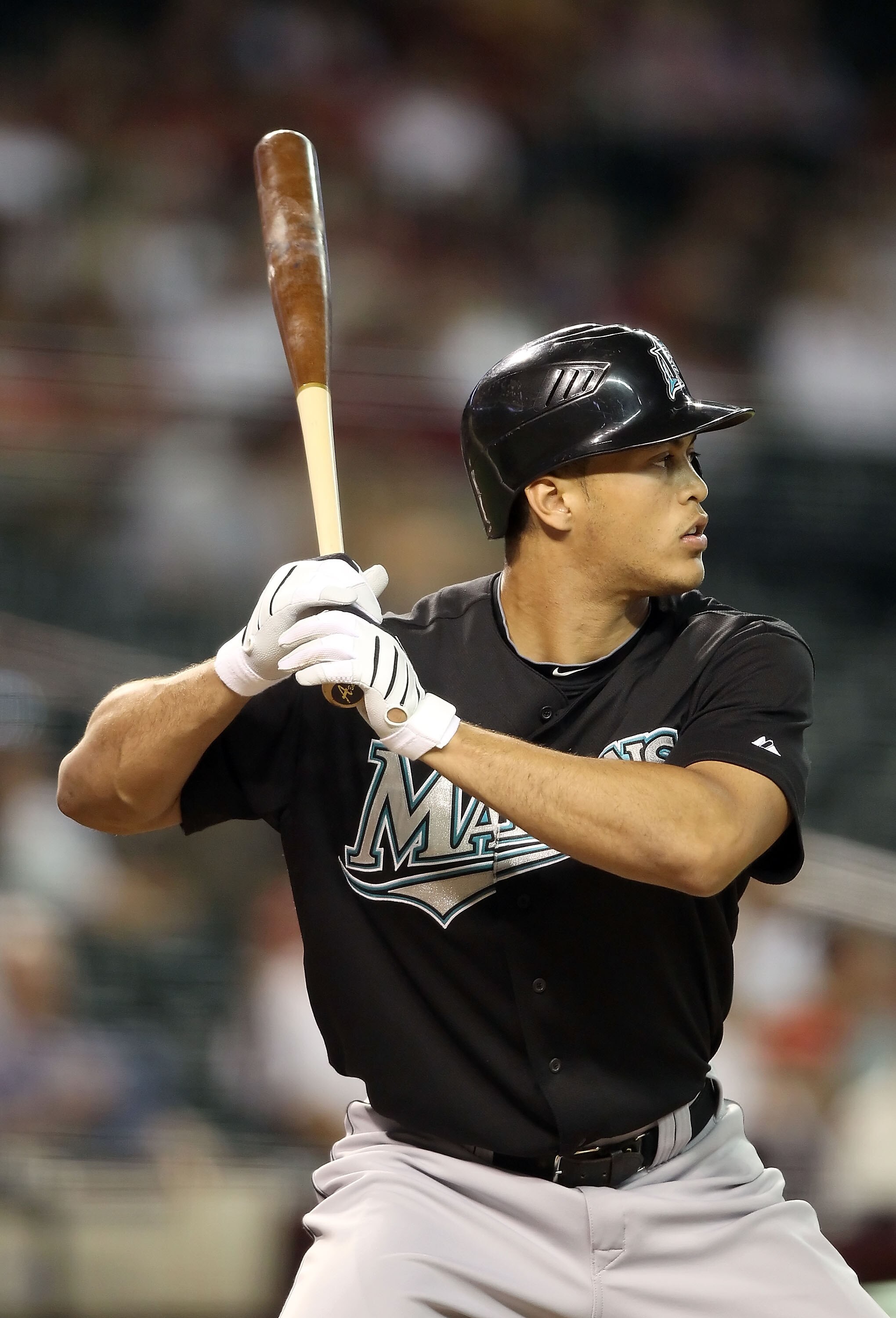 PHOENIX - JULY 08:  Mike Stanton #27 of the Florida Marlins warms up on deck during the Major League Baseball game against the Arizona Diamondbacks at Chase Field on July 8, 2010 in Phoenix, Arizona. The Diamondbacks defeated the Marlins 10-4.  (Photo by