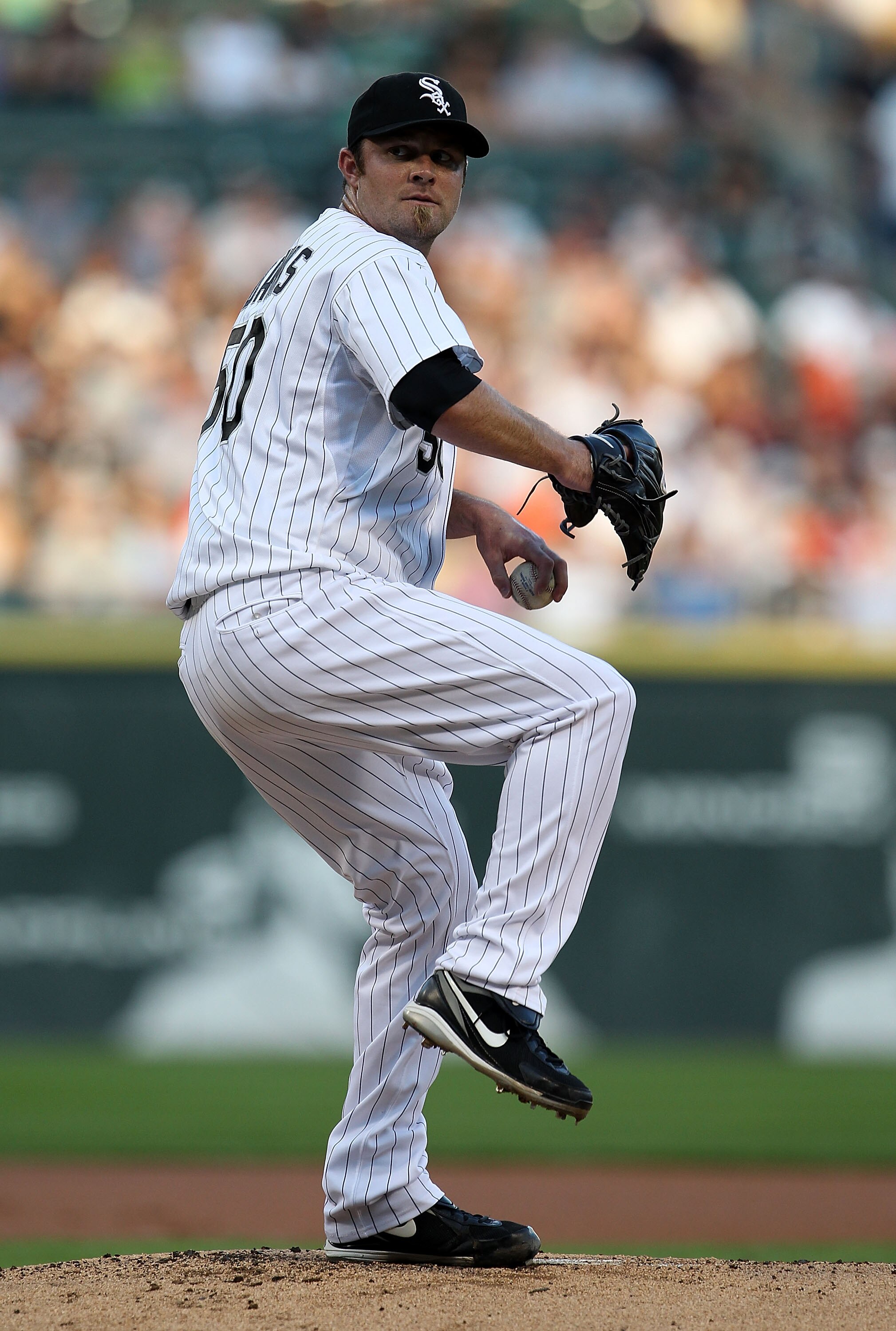 CHICAGO - JULY 26: Starting pitcher John Danks #50 of the Chicago White Sox delivers the ball against the Seattle Mariners at U.S. Cellular Field on July 26, 2010 in Chicago, Illinois. (Photo by Jonathan Daniel/Getty Images)