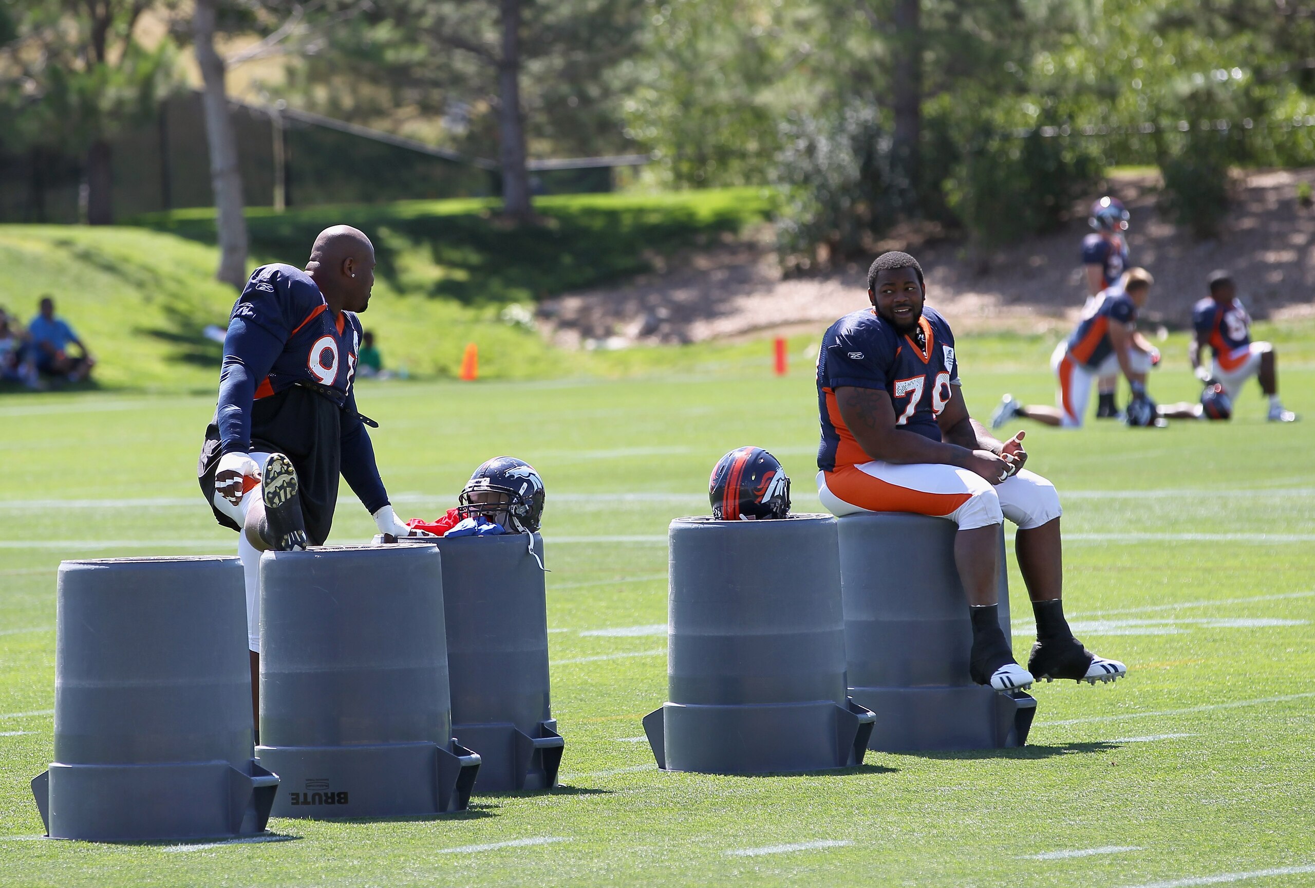 ENGLEWOOD, CO - AUGUST 18:  Defensive linemen Ronald Fields #91 and Marcus Thomas #91 of the Denver Broncos prepare for training camp practice at Dove Valley on August 18, 2010 in Englewood, Colorado. The forecasted record high tempuratures hovered in the
