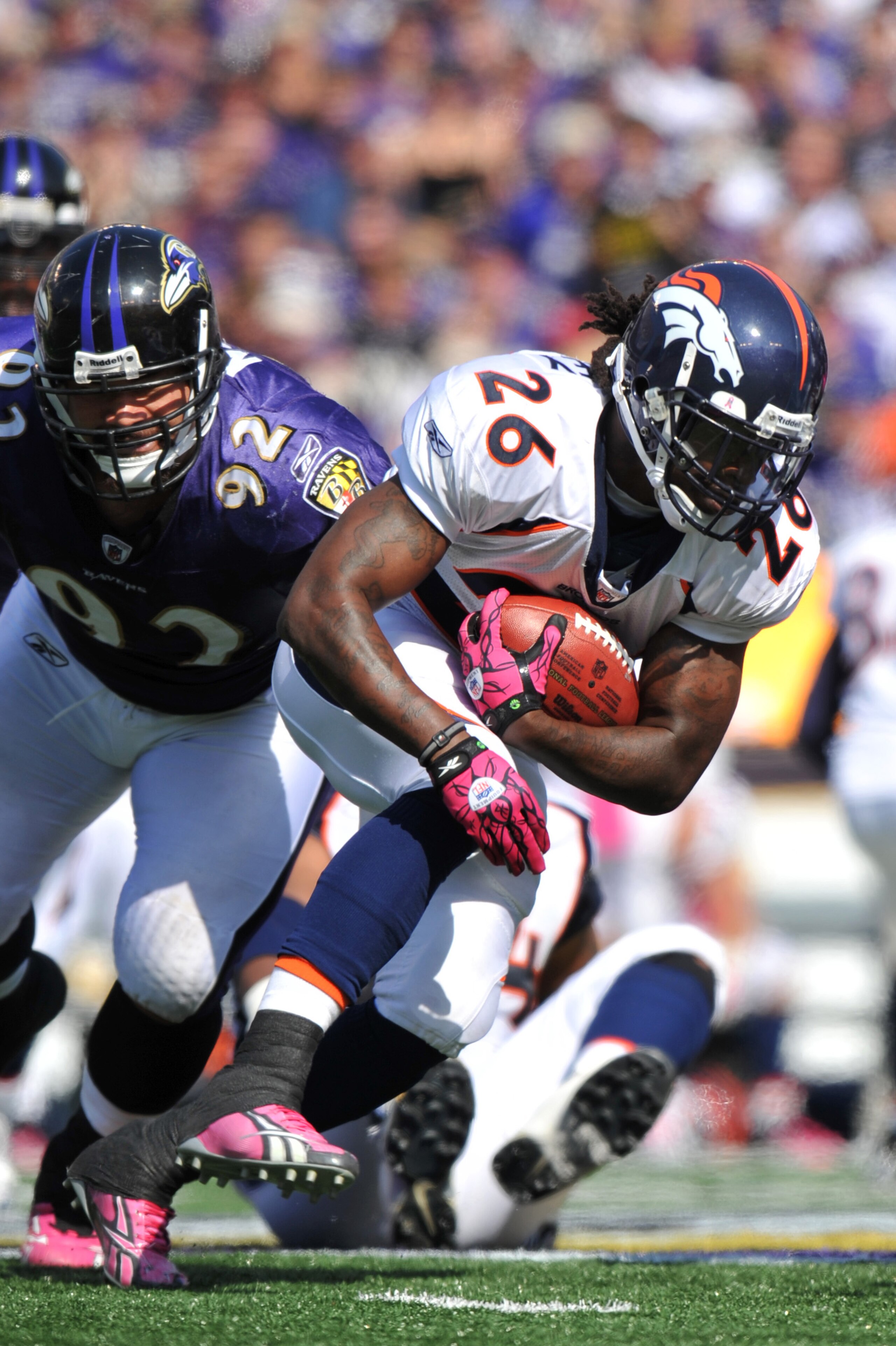 BALTIMORE, MD - OCTOBER 10: Laurence Maroney #26 of the Denver Broncos runs the ball against the Baltimore Ravens at M&T Bank Stadium on October 10, 2010 in Baltimore, Maryland. Players wore pink in recognition of Breast Cancer Awareness Month. The Ravens