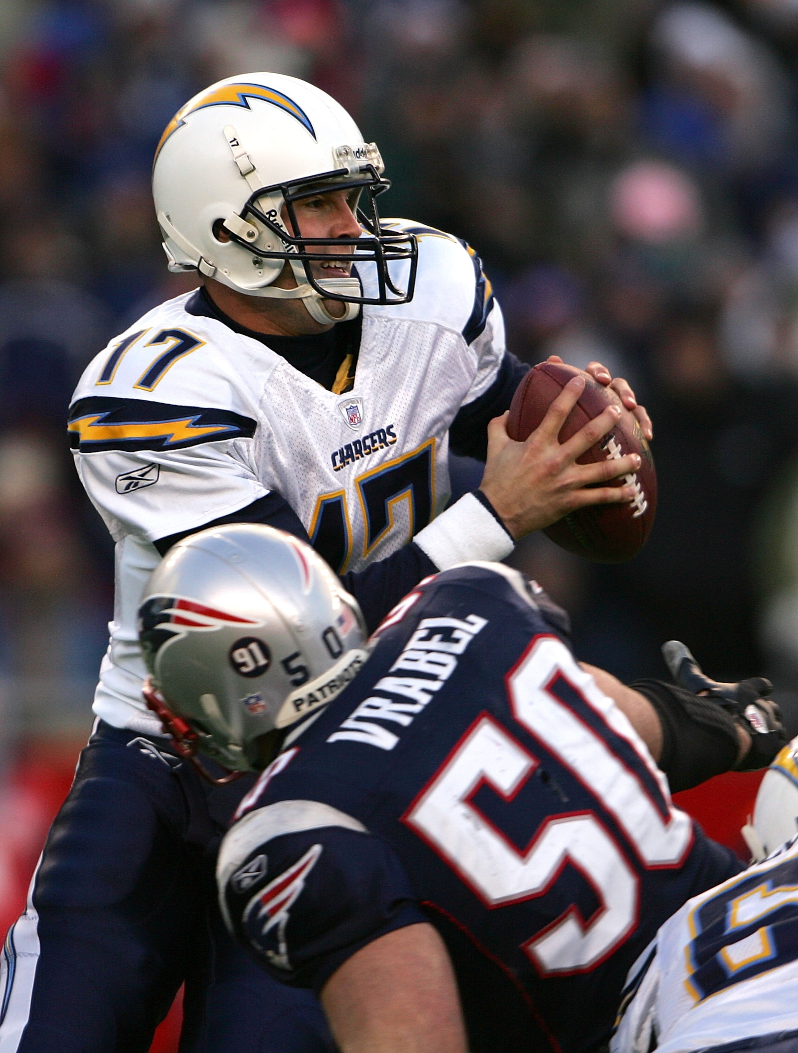 FOXBORO, MA - JANUARY 20:  Philip Rivers #17 of the San Diego Chargers looks to pass under pressure from Mike Vrabel #50 of the New England Patriots during the AFC Championship Game on January 20, 2008 at Gillette Stadium in Foxboro, Massachusetts.  (Phot