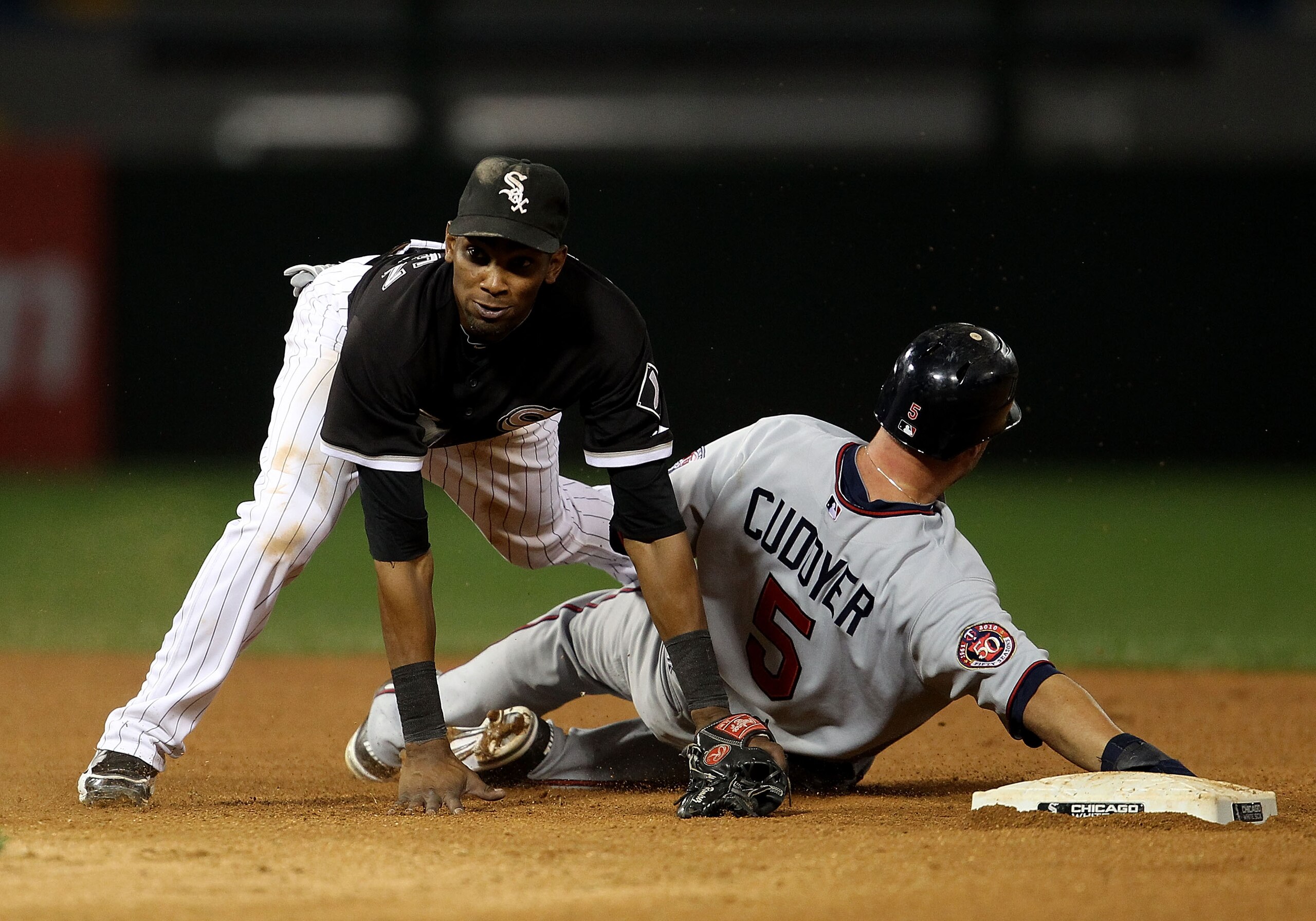 CHICAGO - SEPTEMBER 14: Alexei Ramirez #10 of the Chicago White Sox falls over Michael Cuddyer #5 of the Minnesota Twins after turning a double play at U.S. Cellular Field on September 14, 2010 in Chicago, Illinois. (Photo by Jonathan Daniel/Getty Images) CHICAGO - SEPTEMBER 14: Alexei Ramirez #10 of the Chicago White Sox falls over Michael Cuddyer #5 of the Minnesota Twins after turning a double play at U.S. Cellular Field on September 14, 2010 in Chicago, Illinois. (Photo by Jonathan Daniel/Getty Images)