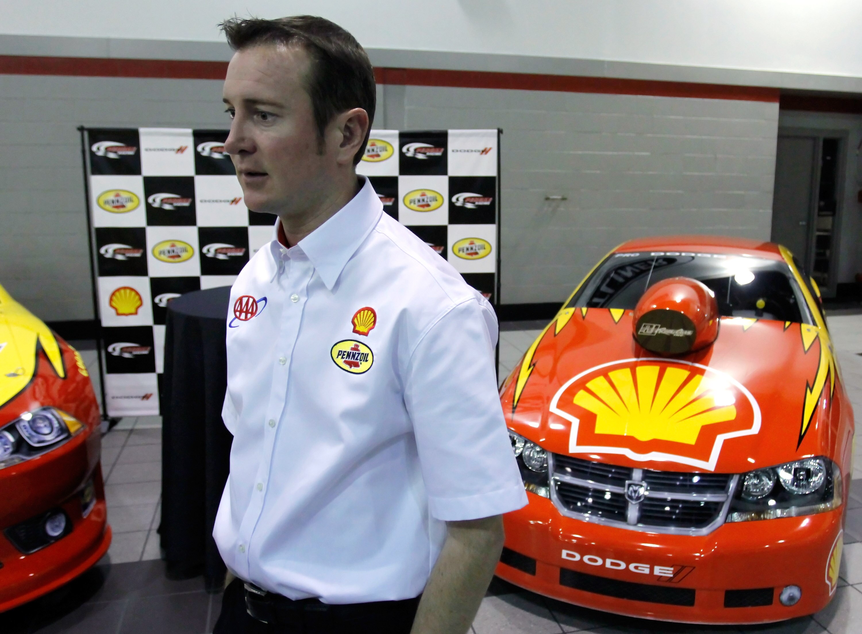 MOORESVILLE, NC - JANUARY 24: Kurt Busch, driver of the #22 Shell/Pennzoil Dodge, speaks to the media during the NASCAR Sprint Media Tour hosted by Charlotte Motor Speedway, held at Penske Racing on January 24, 2011 in Mooresville, North Carolina. (Photo