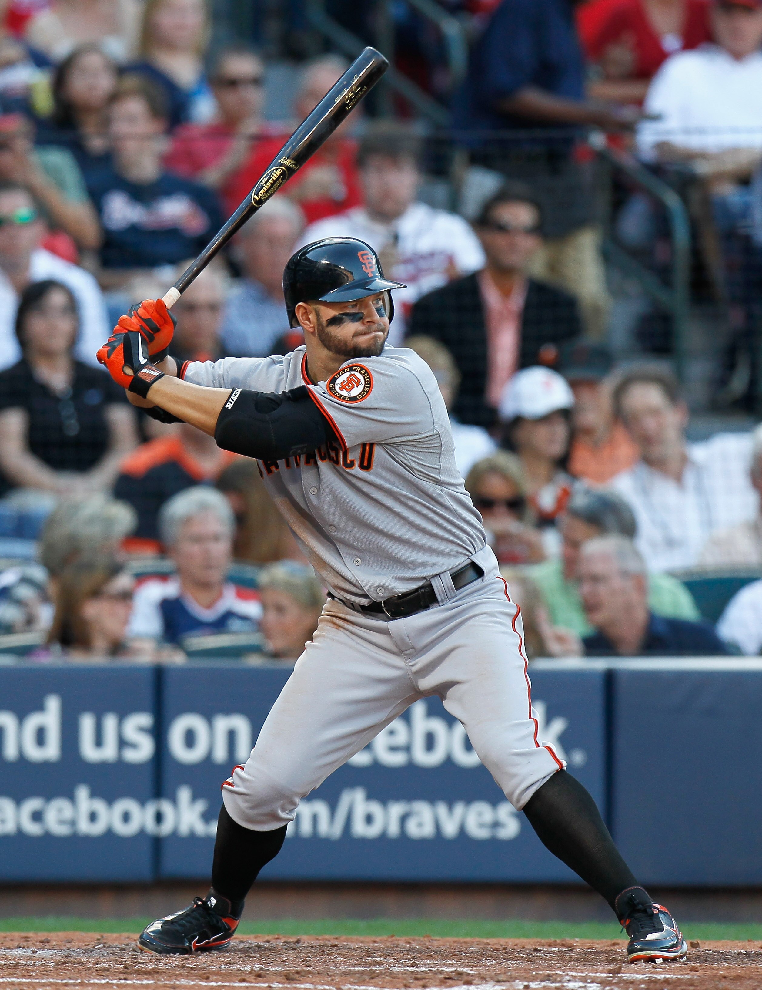ATLANTA - OCTOBER 10:  Cody Ross #13 of the San Francisco Giants against the Atlanta Braves during Game Three of the NLDS of the 2010 MLB Playoffs at Turner Field on October 10, 2010 in Atlanta, Georgia.  (Photo by Kevin C. Cox/Getty Images)