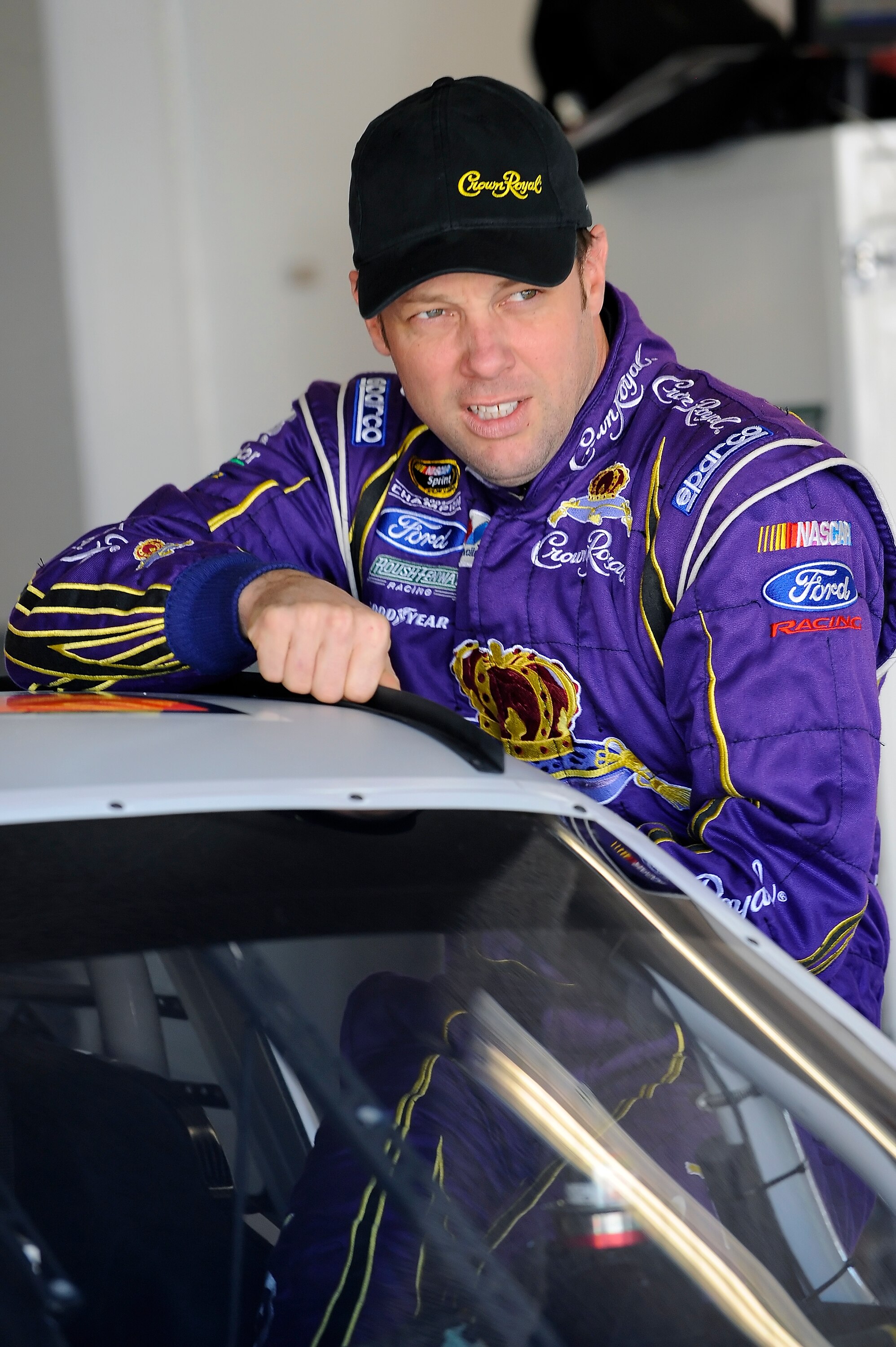 DAYTONA BEACH, FL - JANUARY 22:  Matt Kenseth, driver of the #17 Crown Royal Ford, climbs in his car prior to testing at Daytona International Speedway on January 22, 2011 in Daytona Beach, Florida.  (Photo by Jared C. Tilton/Getty Images for NASCAR)