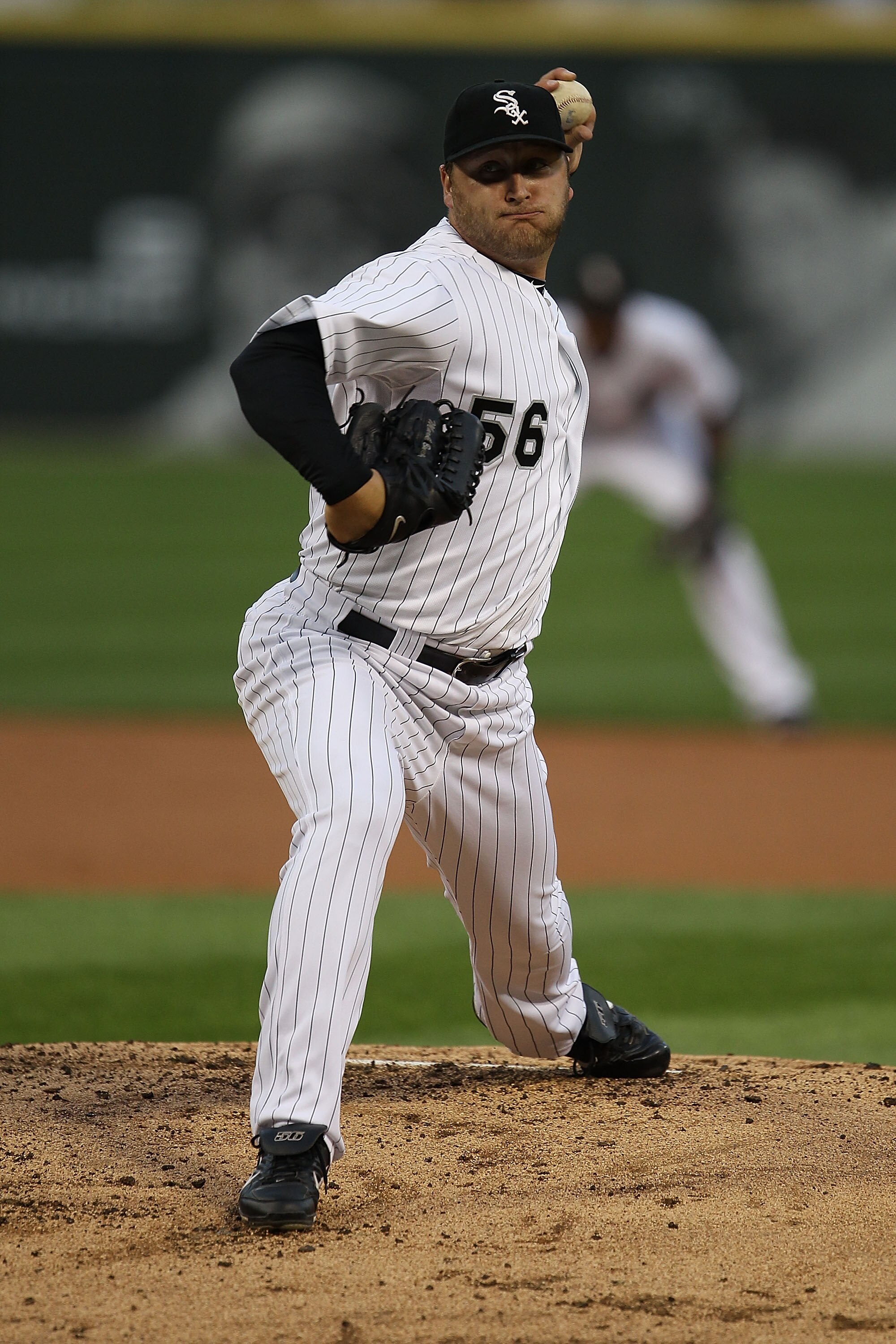 CHICAGO - AUGUST 25: Starting pitcher Mark Buehrle #56 of the Chicago White Sox delivers the ball against the Baltimore Orioles at U.S. Cellular Field on August 25, 2010 in Chicago, Illinois. The Orioles defeated the White Sox 4-2. (Photo by Jonathan Dani