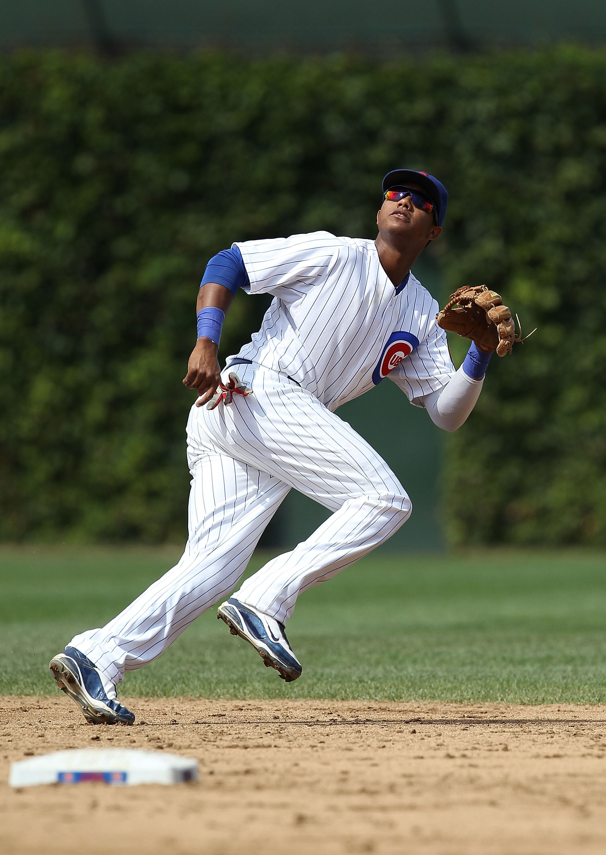 CHICAGO - SEPTEMBER 05: Starlin Castro #13 of the Chicago Cubs chases a fly ball against the New York Mets at Wrigley Field on September 5, 2010 in Chicago, Illinois. The Mets defeated the Cubs 18-5. (Photo by Jonathan Daniel/Getty Images)