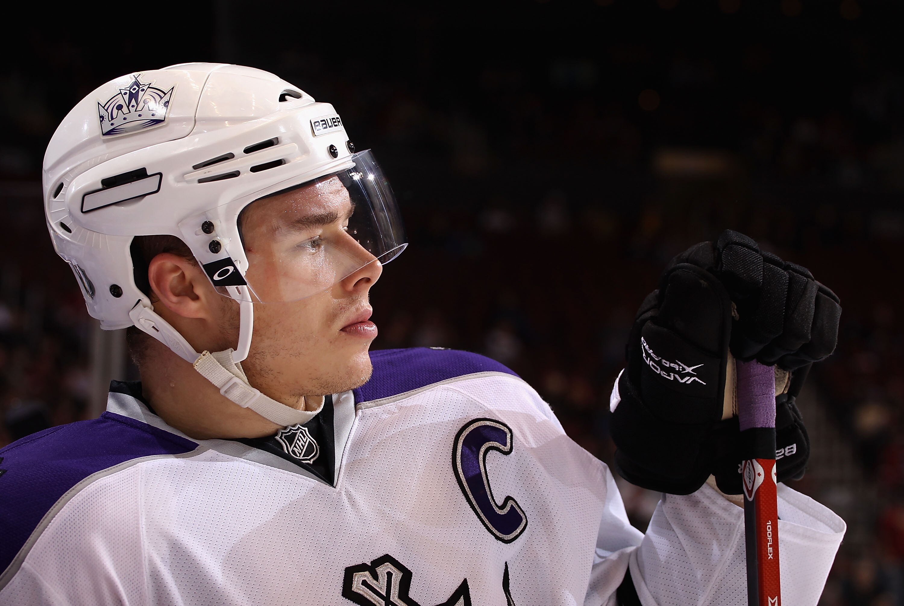 GLENDALE, AZ - JANUARY 22:  Dustin Brown #23 of the Los Angeles Kings waits by the bench during a time out from the NHL game against the Phoenix Coyotes at Jobing.com Arena on January 22, 2011 in Glendale, Arizona.  The Kings defeated the Coyotes 4-3.  (P