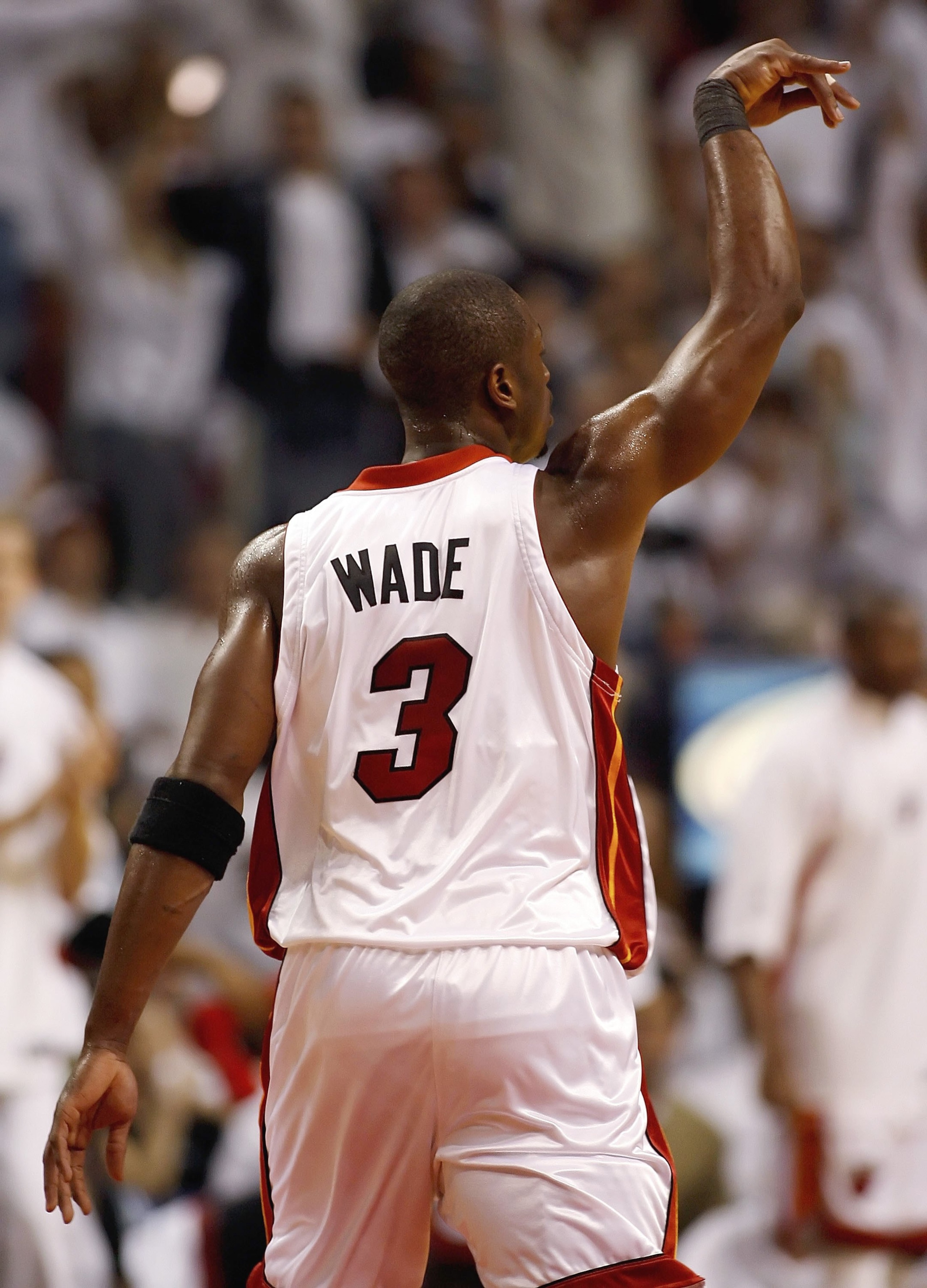 MIAMI - JUNE 2:  Dwyane Wade #3 of the Miami Heat reacts to a basket against the Detroit Pistons in game six of the Eastern Conference Finals during the 2006 NBA Playoffs on June 2, 2006 at American Airlines Arena in Miami, Florida.  NOTE TO USER: User ex