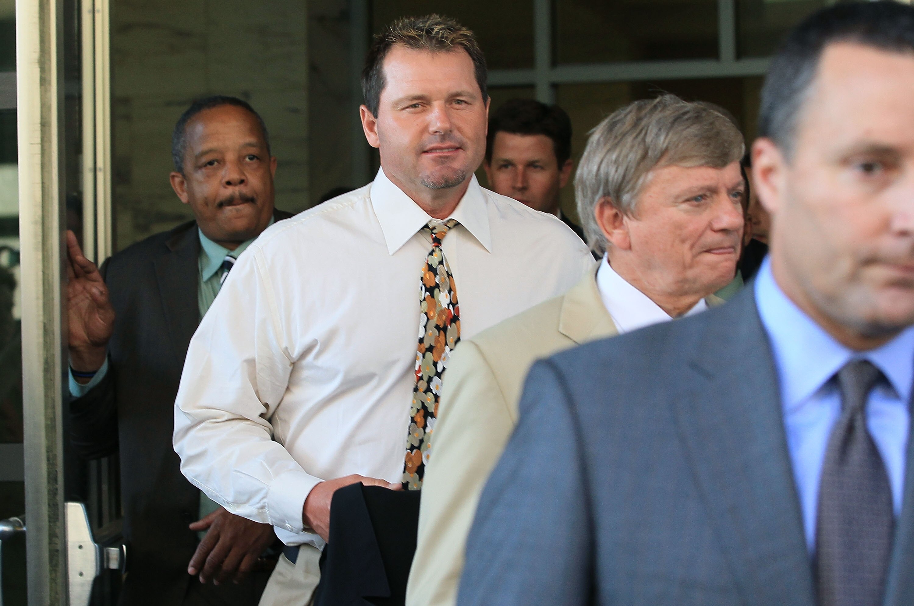 WASHINGTON - AUGUST 30:  Baseball pitching star Roger Clemens walks out of the U.S. District Court after his arraignment, on August 30, 2010 in Washington, DC. Clemens who plead not-guilty was charged with making false statements, perjury and obstructing