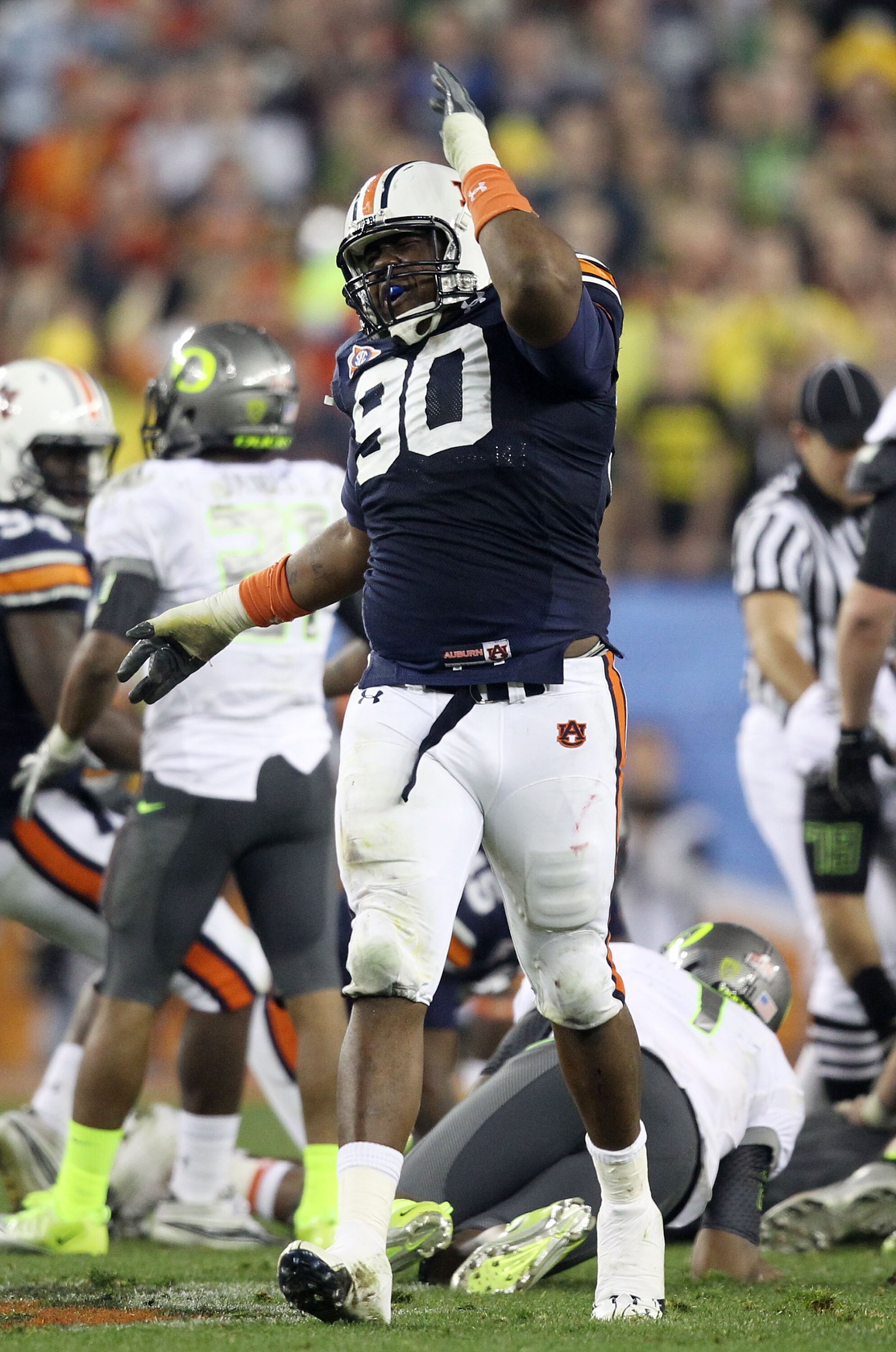 GLENDALE, AZ - JANUARY 10: Nick Fairley #90 of the Auburn Tigers reacts during their Tostitos BCS National Championship Game against the Oregon Ducks at University of Phoenix Stadium on January 10, 2011 in Glendale, Arizona. (Photo by Christian Petersen GLENDALE, AZ - JANUARY 10: Nick Fairley #90 of the Auburn Tigers reacts during their Tostitos BCS National Championship Game against the Oregon Ducks at University of Phoenix Stadium on January 10, 2011 in Glendale, Arizona. (Photo by Christian Petersen