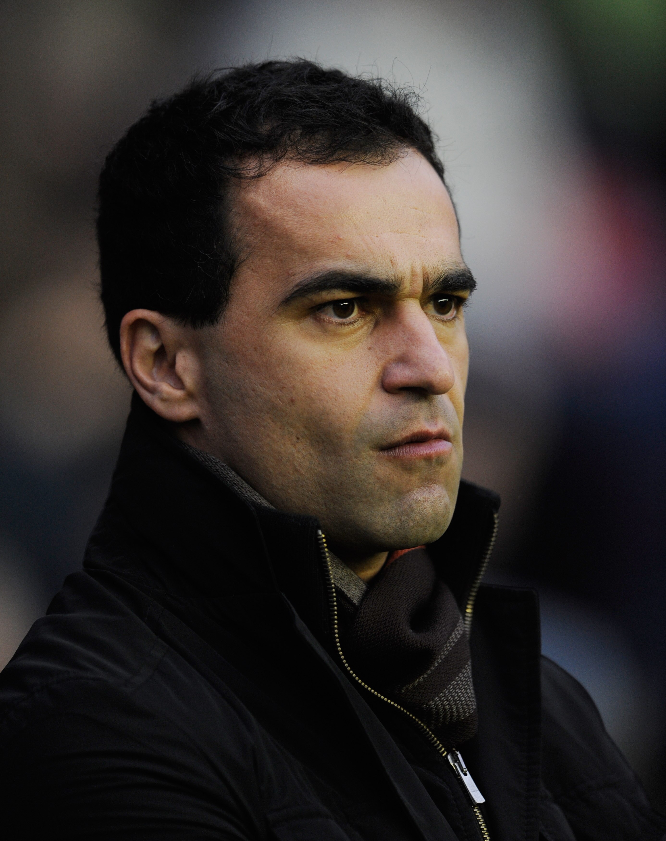 WIGAN, ENGLAND - JANUARY 15:  Wigan manager Roberto Martinez looks on before the Premier League match between Wigan Athletic and Fulham at the DW Stadium on January 15, 2011 in Wigan, England.  (Photo by Michael Regan/Getty Images)