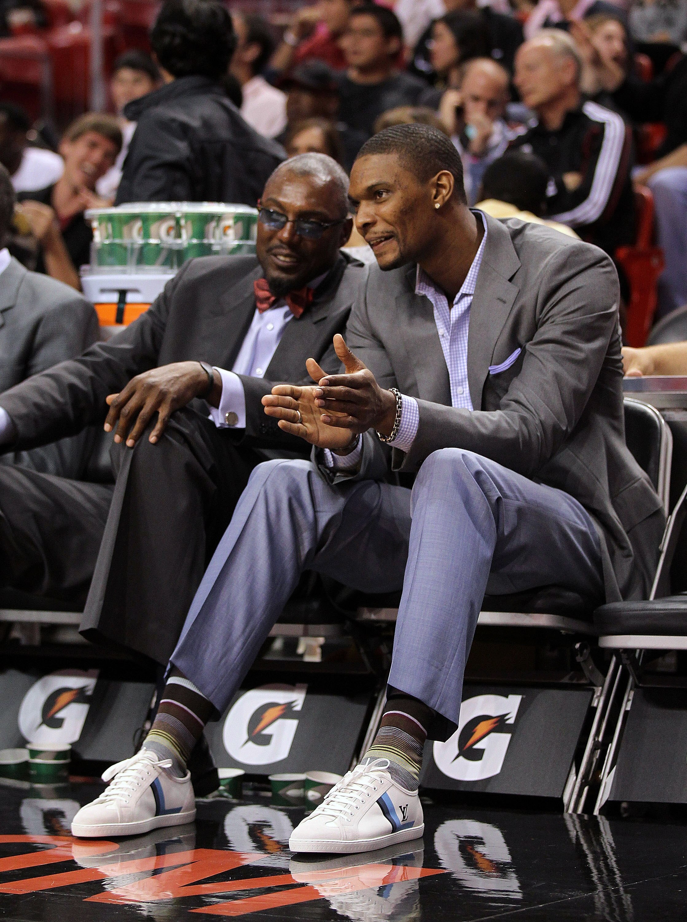 MIAMI, FL - JANUARY 22: Chris Bosh #1 of the Miami Heat talks with assistant coach Keith Askins during a game against the Toronto Raptors at American Airlines Arena on January 22, 2011 in Miami, Florida. NOTE TO USER: User expressly acknowledges and agree