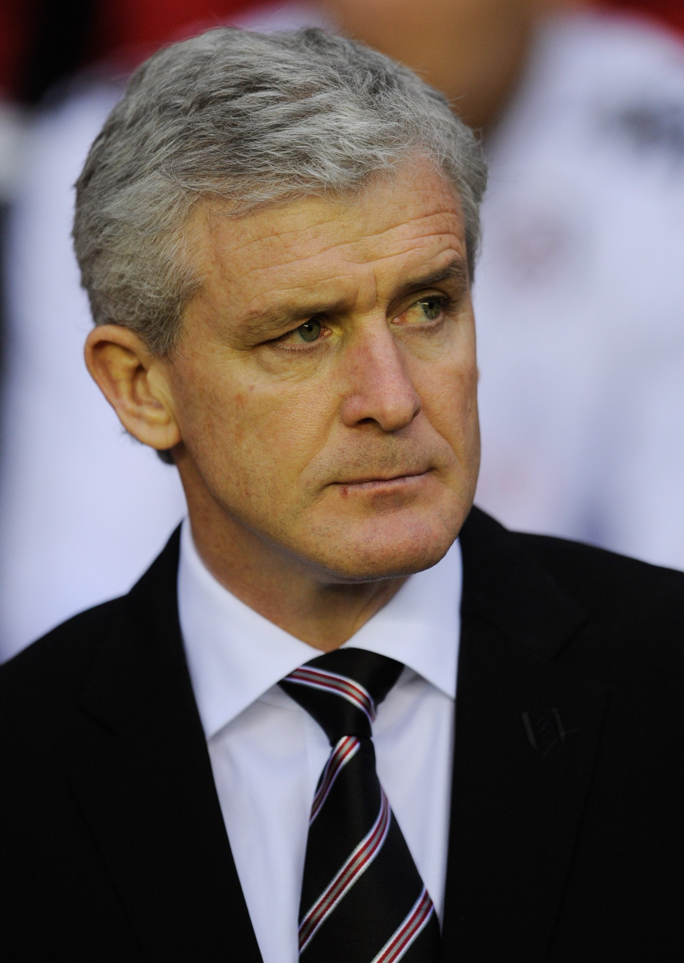 WIGAN, ENGLAND - JANUARY 15: Fulham manager Mark Hughes looks on before the Premier League match between Wigan Athletic and Fulham at the DW Stadium on January 15, 2011 in Wigan, England.  (Photo by Michael Regan/Getty Images)
