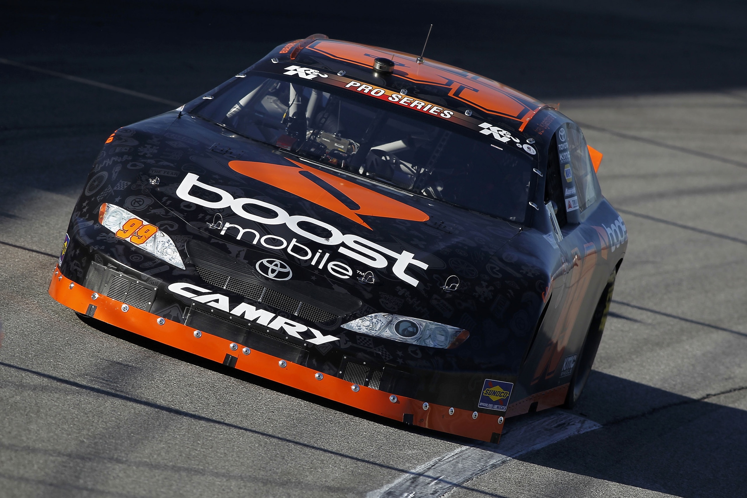 IRWINDALE, CA - JANUARY 28:  Travis Pastrana, driver of the #99 Boost Mobile Toyota, drives during practice for the NASCAR Toyota All-Star Showdown at Toyota Speedway at Irwindale on January 28, 2011 in Irwindale, California.  (Photo by Todd Warshaw/Getty