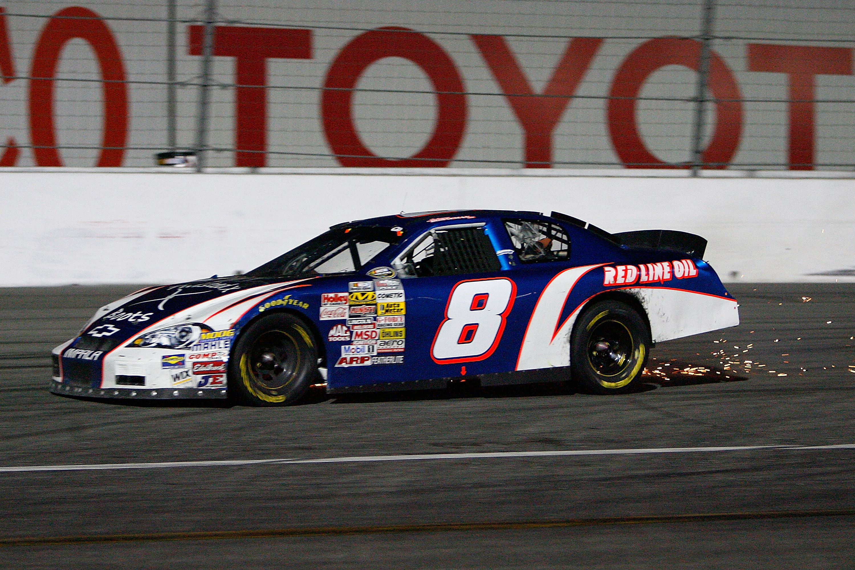 IRWINDALE, CA - JULY 4: Johnny Borneman driver of the #8 Twisted X Boots/Red Line Oil Ford has sparks flying from his car during the NASCAR Camping World Series West King Taco 200 race at the Toyota Speedway on July 4, 2009 in Irwindale, California. (Phot