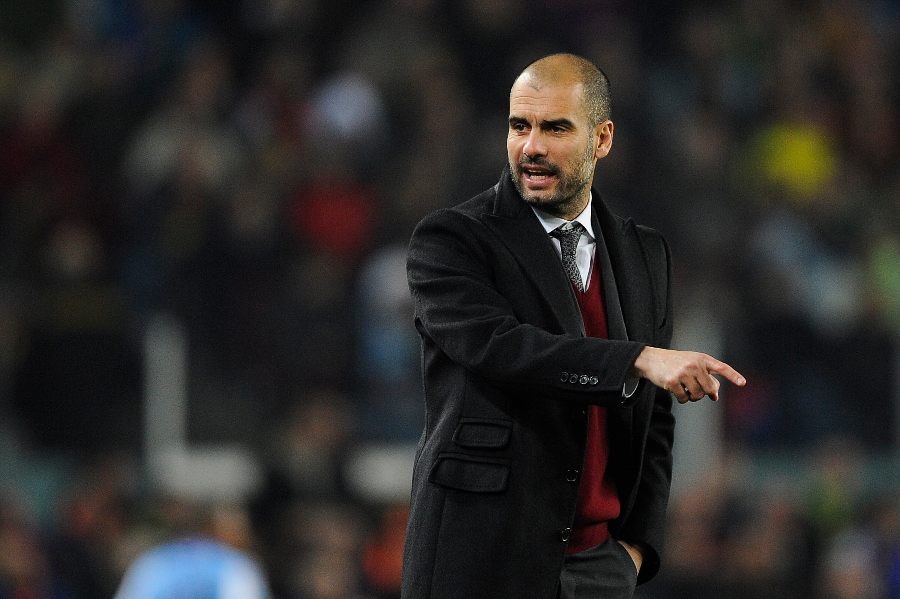 BARCELONA, SPAIN - JANUARY 16:  Head coach Josep Guardila of FC Barcelona reacts during the La Liga match between FC Barcelona and Malaga at Nou Camp on January 16, 2011 in Barcelona, Spain. Barcelona won 4-1.  (Photo by David Ramos/Getty Images)