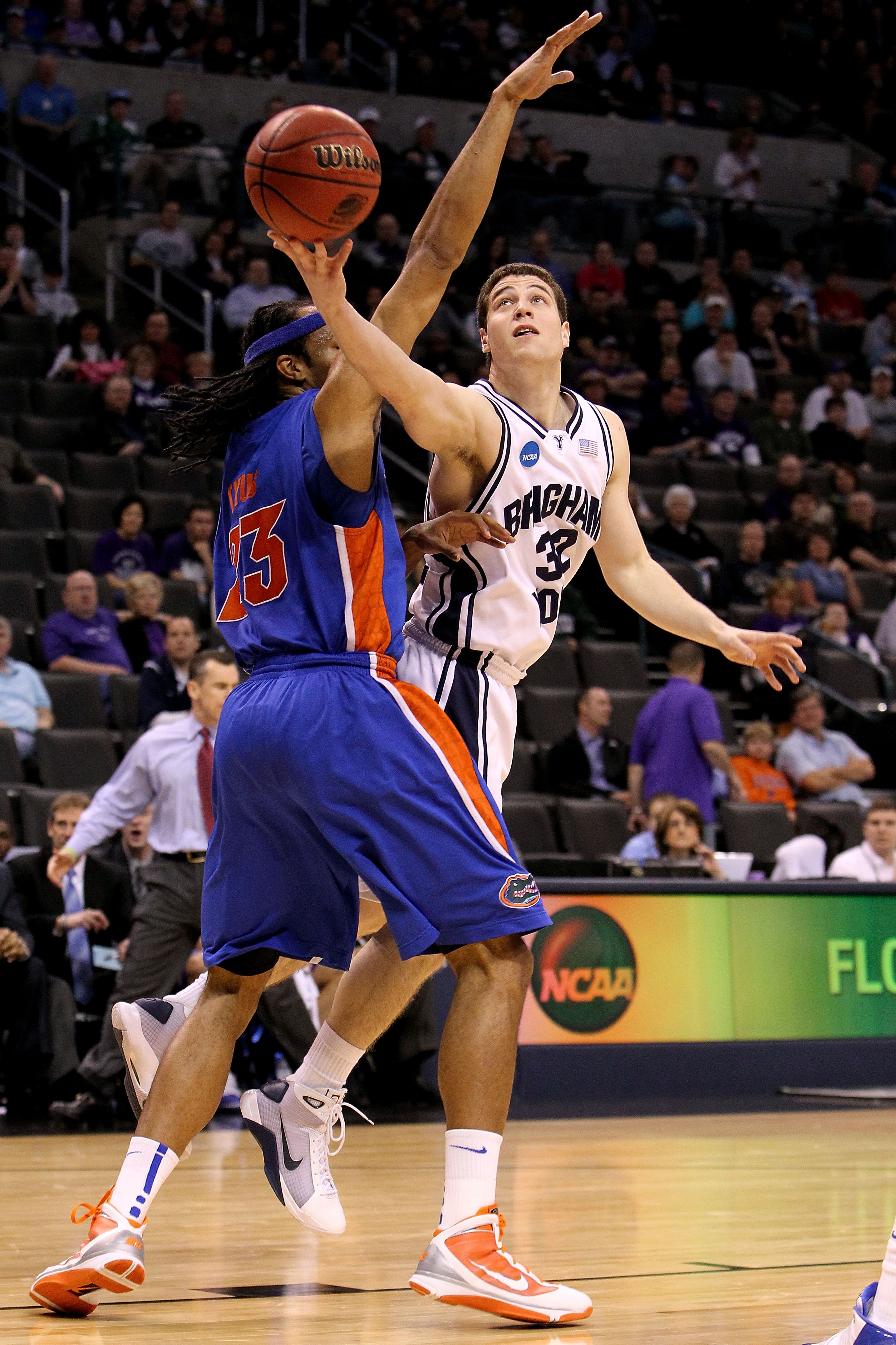 OKLAHOMA CITY - MARCH 18:  Jimmer Fredette #32 of the BYU Cougars drives for a shot attempt against Alex Tyus #23 of the Florida Gators during the first round of the 2010 NCAA menï¿½s basketball tournament at Ford Center on March 18, 2010 in Oklahoma City,