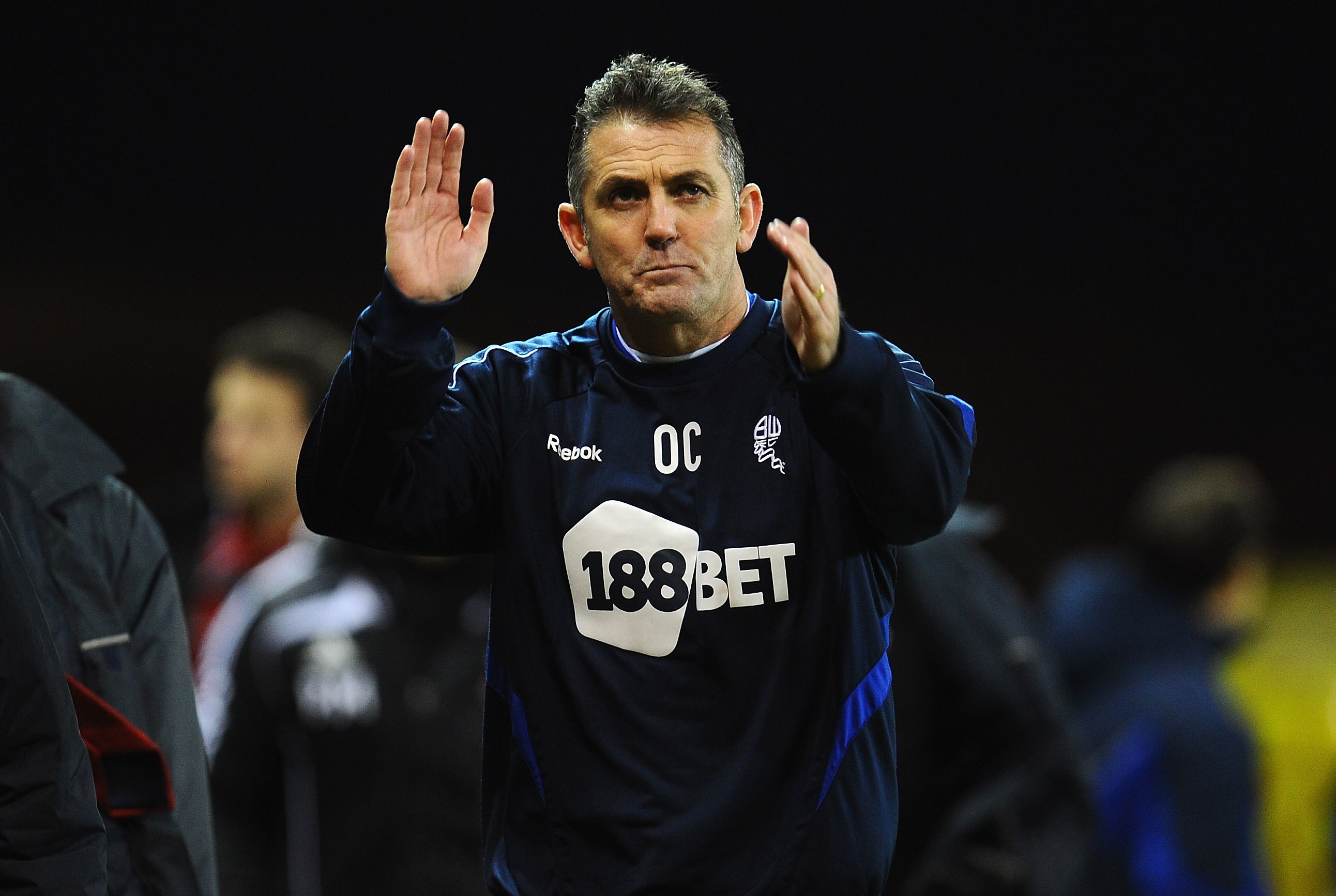 STOKE ON TRENT, ENGLAND - JANUARY 15:  Owen Coyle of Bolton Wanderers applauds the crowd after the Barclays Premier League match between Stoke City and Bolton Wanderers at Britannia Stadium on January 15, 2011 in Stoke on Trent, England.  (Photo by Clive