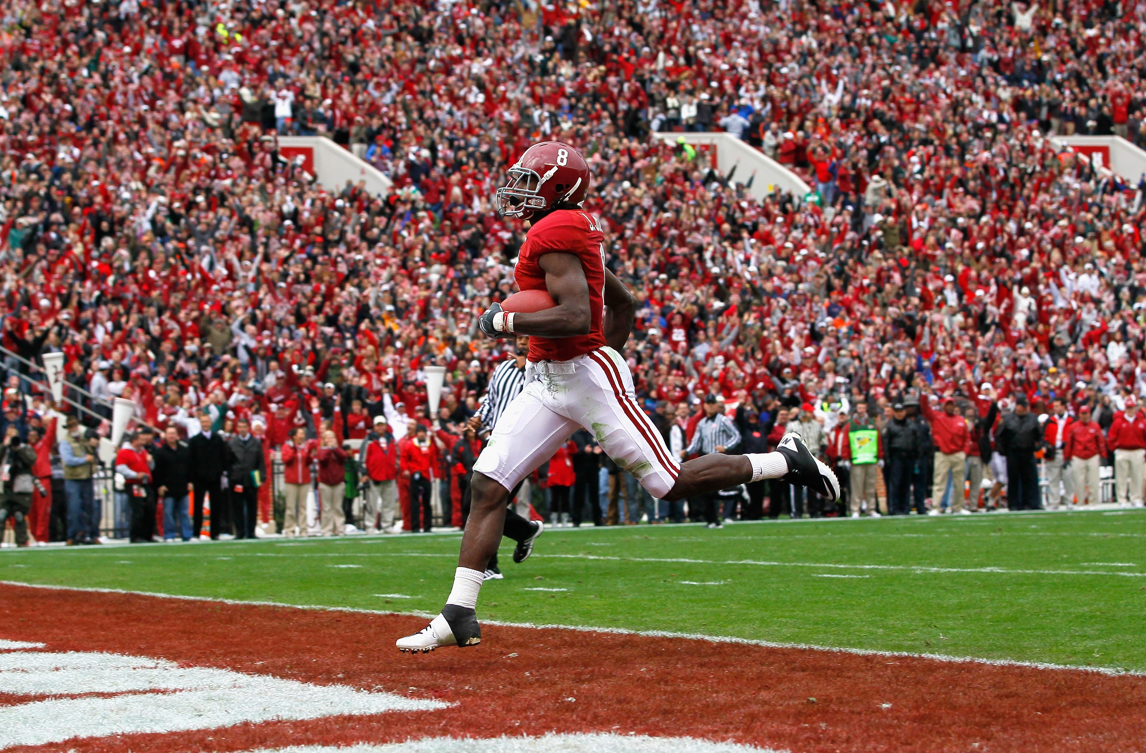 TUSCALOOSA, AL - NOVEMBER 26: Julio Jones #8 of the Alabama Crimson Tide crosses the goal line for a touchdown against the Auburn Tigers at Bryant-Denny Stadium on November 26, 2010 in Tuscaloosa, Alabama. (Photo by Kevin C. Cox/Getty Images) TUSCALOOSA, AL - NOVEMBER 26: Julio Jones #8 of the Alabama Crimson Tide crosses the goal line for a touchdown against the Auburn Tigers at Bryant-Denny Stadium on November 26, 2010 in Tuscaloosa, Alabama. (Photo by Kevin C. Cox/Getty Images)