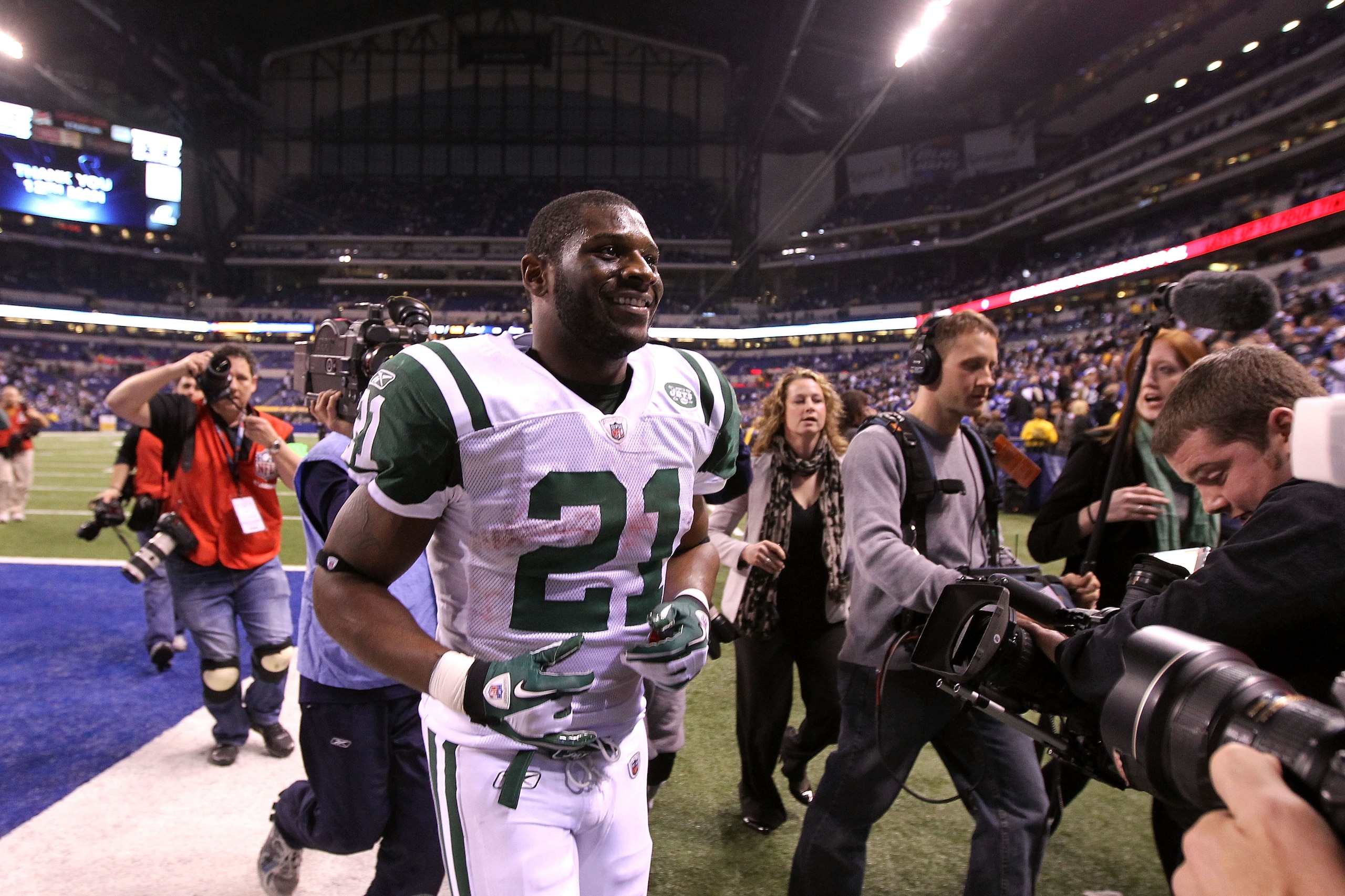INDIANAPOLIS, IN - JANUARY 08:  LaDainian Tomlinson #21 of the New York Jets celebrates as he runs off the field after the Jets won 17-16 against the Indianapolis Colts during their 2011 AFC wild card playoff game at Lucas Oil Stadium on January 8, 2011 i