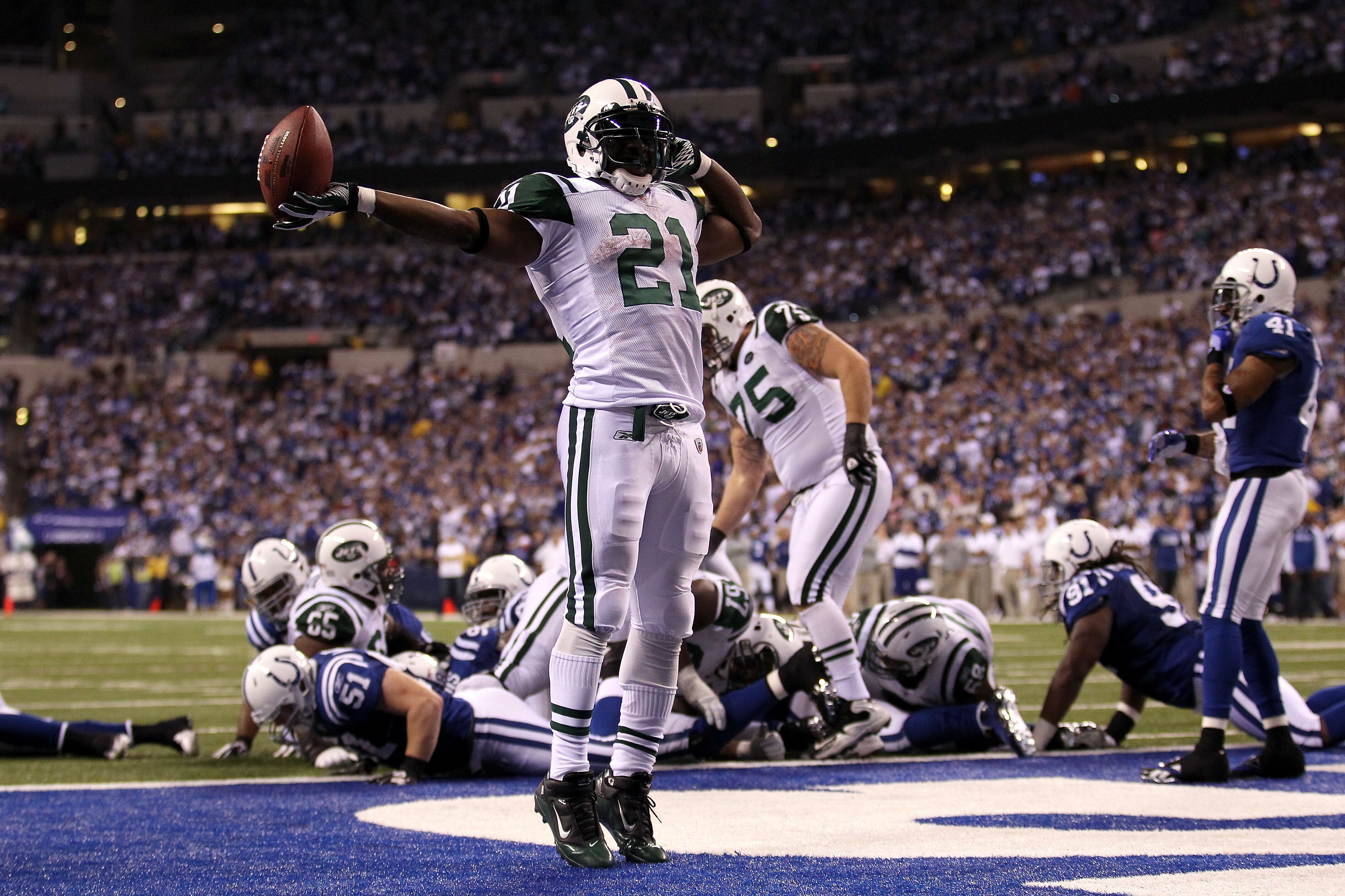 INDIANAPOLIS, IN - JANUARY 08:  LaDainian Tomlinson #21 of the New York Jets celebrates after he scored a 1-yard touchdown in the fourth quarter against the Indianapolis Colts during their 2011 AFC wild card playoff game at Lucas Oil Stadium on January 8,