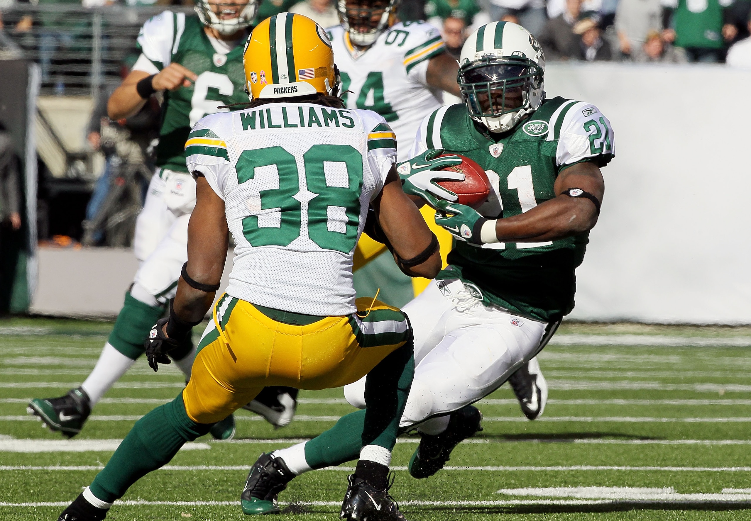 EAST RUTHERFORD, NJ - OCTOBER 31:  LaDainian Tomlinson #21 of the New York Jets runs the ball against Tramon Williams #38 of the Green Bay Packers on October 31, 2010 at the New Meadowlands Stadium in East Rutherford, New Jersey.  (Photo by Jim McIsaac/Ge