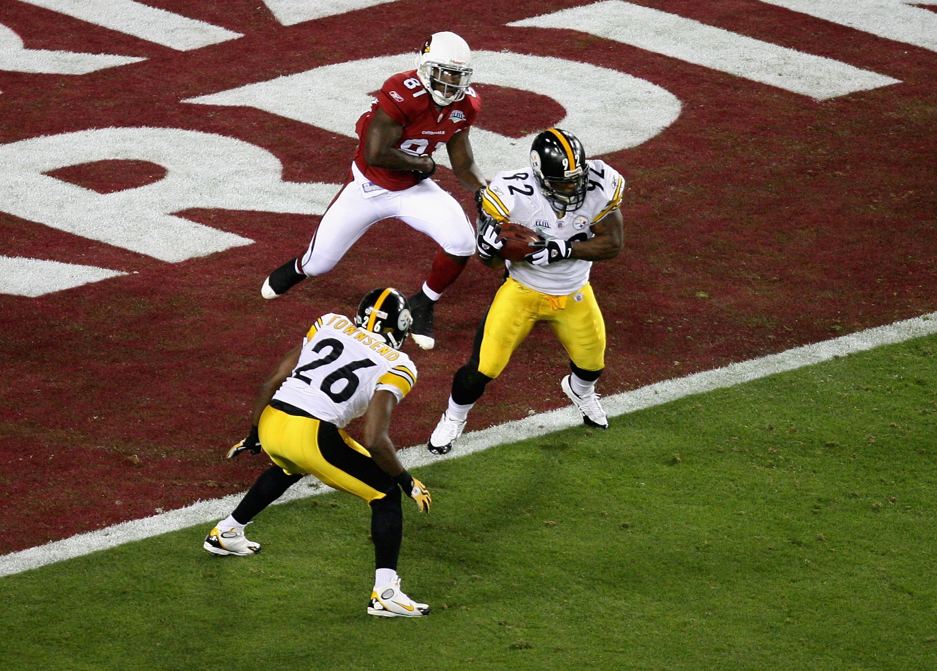 TAMPA, FL - FEBRUARY 01:  James Harrison #92 of the Pittsburgh Steelers makes an interception in the Cardinals endzone in the second quarter against the Arizona Cardinals during Super Bowl XLIII on February 1, 2009 at Raymond James Stadium in Tampa, Flori