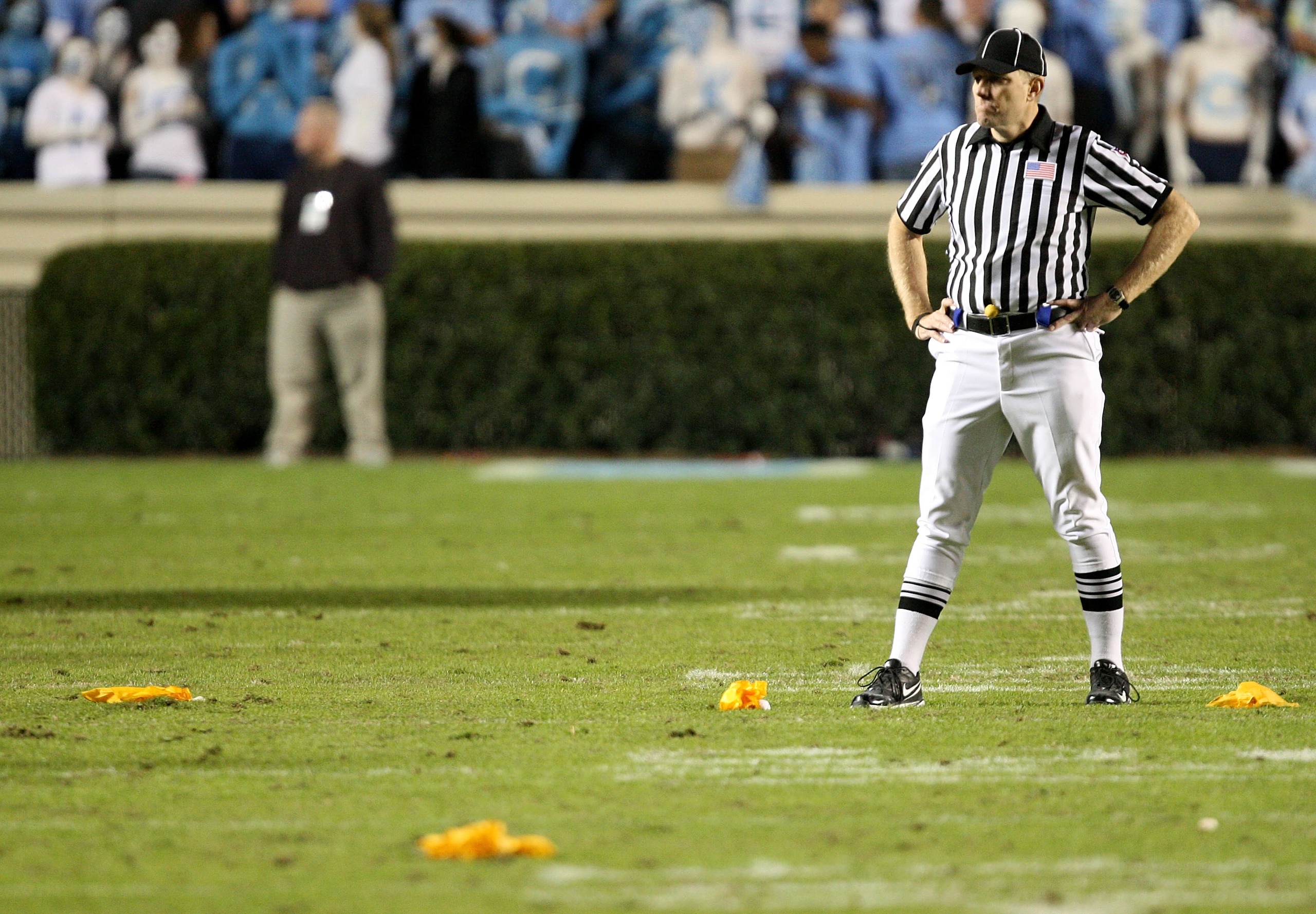 CHAPEL HILL, NC - NOVEMBER 07: A referee stands in the middle of four penalty flags that were all thrown on the same play during a rivalry game between the Duke Blue Devils and North Carolina Tar Heels at Kenan Stadium on November 7, 2009 in Chapel Hill, CHAPEL HILL, NC - NOVEMBER 07: A referee stands in the middle of four penalty flags that were all thrown on the same play during a rivalry game between the Duke Blue Devils and North Carolina Tar Heels at Kenan Stadium on November 7, 2009 in Chapel Hill,