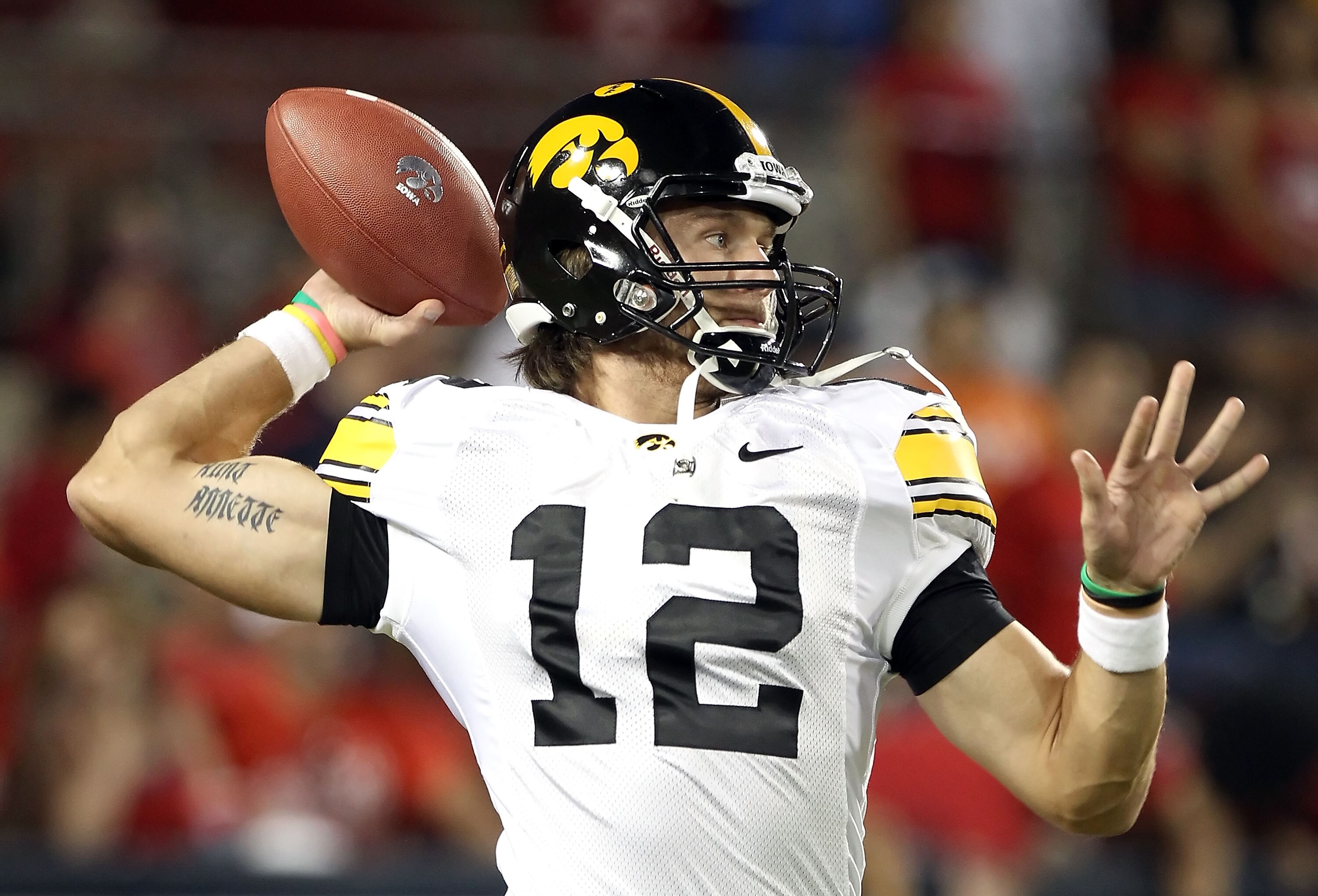TUCSON, AZ - SEPTEMBER 18:  Quarterback Ricky Stanzi #12 of the Iowa Hawkeyes warms up before the college football game against the Arizona Wildcats at Arizona Stadium on September 18, 2010 in Tucson, Arizona.  The Wildcats defeated the Hawkeyes 34-27.  (