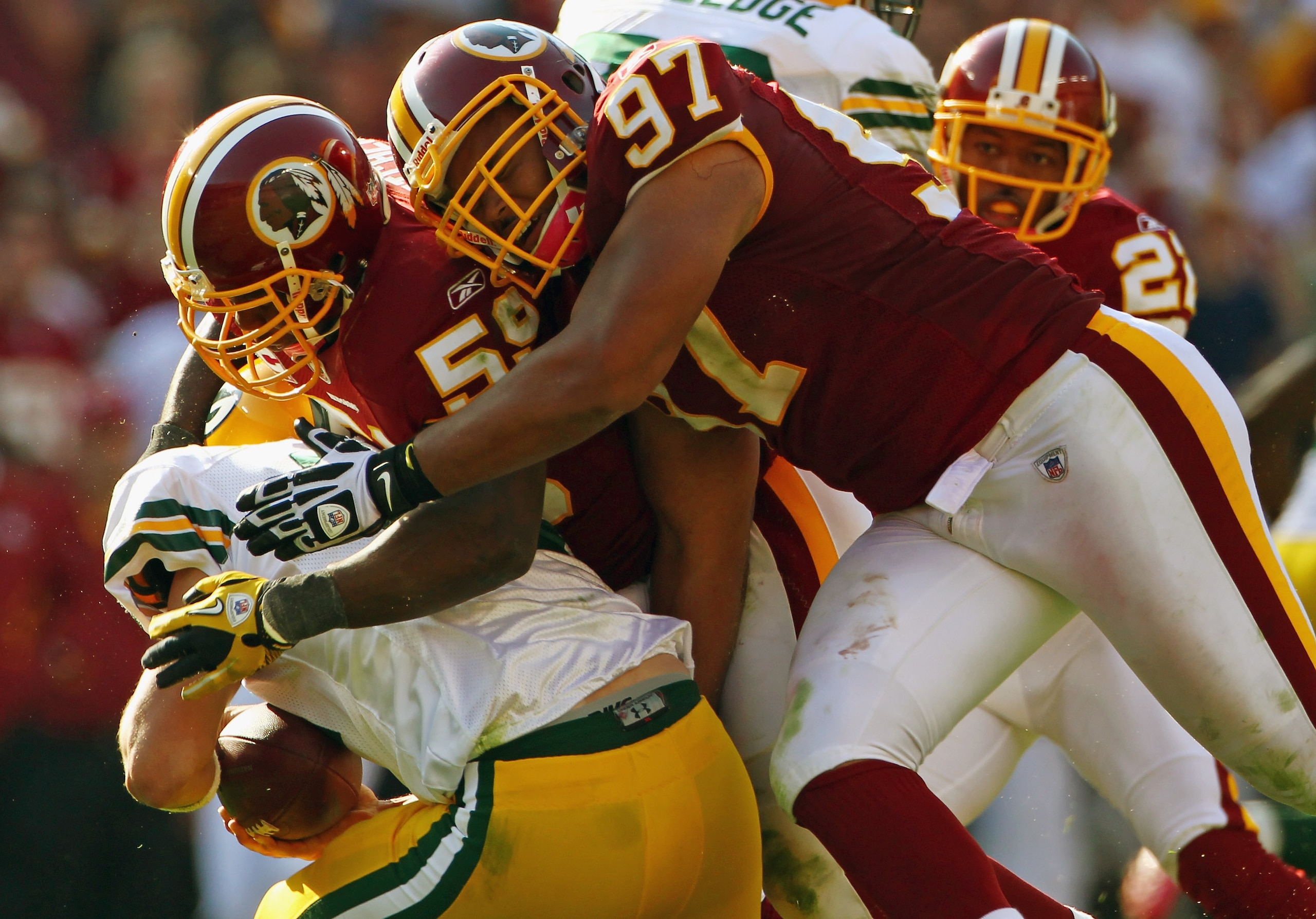 LANDOVER, MD - OCTOBER 10: Linebackers London Fletcher #59 and Lorenzo Alexander #97 of the Washington Redskins sack quarterback Aaron Rodgers #12 of the Green Bay Packers in the fourth quarter against at FedExField on October 10, 2010 in Landover, Maryl LANDOVER, MD - OCTOBER 10: Linebackers London Fletcher #59 and Lorenzo Alexander #97 of the Washington Redskins sack quarterback Aaron Rodgers #12 of the Green Bay Packers in the fourth quarter against at FedExField on October 10, 2010 in Landover, Maryl