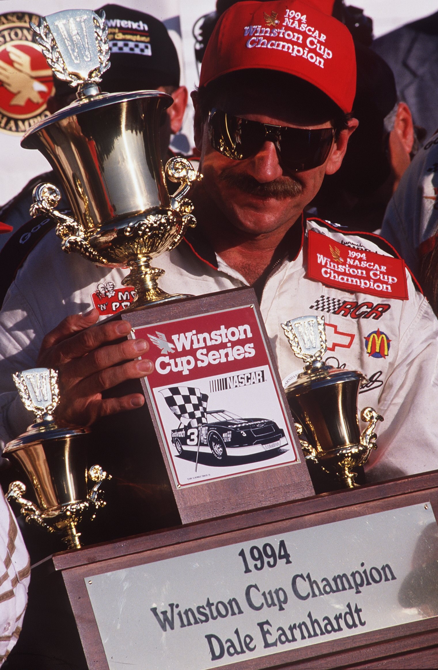 ROCKINGHAM, NC - OCTOBER 23:  Dale Earnhardt driver of the #3 GM Goodwrench Cheverolet poses with the NASCAR Winston Cup championship trophy after winning the AC Delco 500 on October 23, 1994 at the North Carolina Motor Speedway in Rockingham, North Carol
