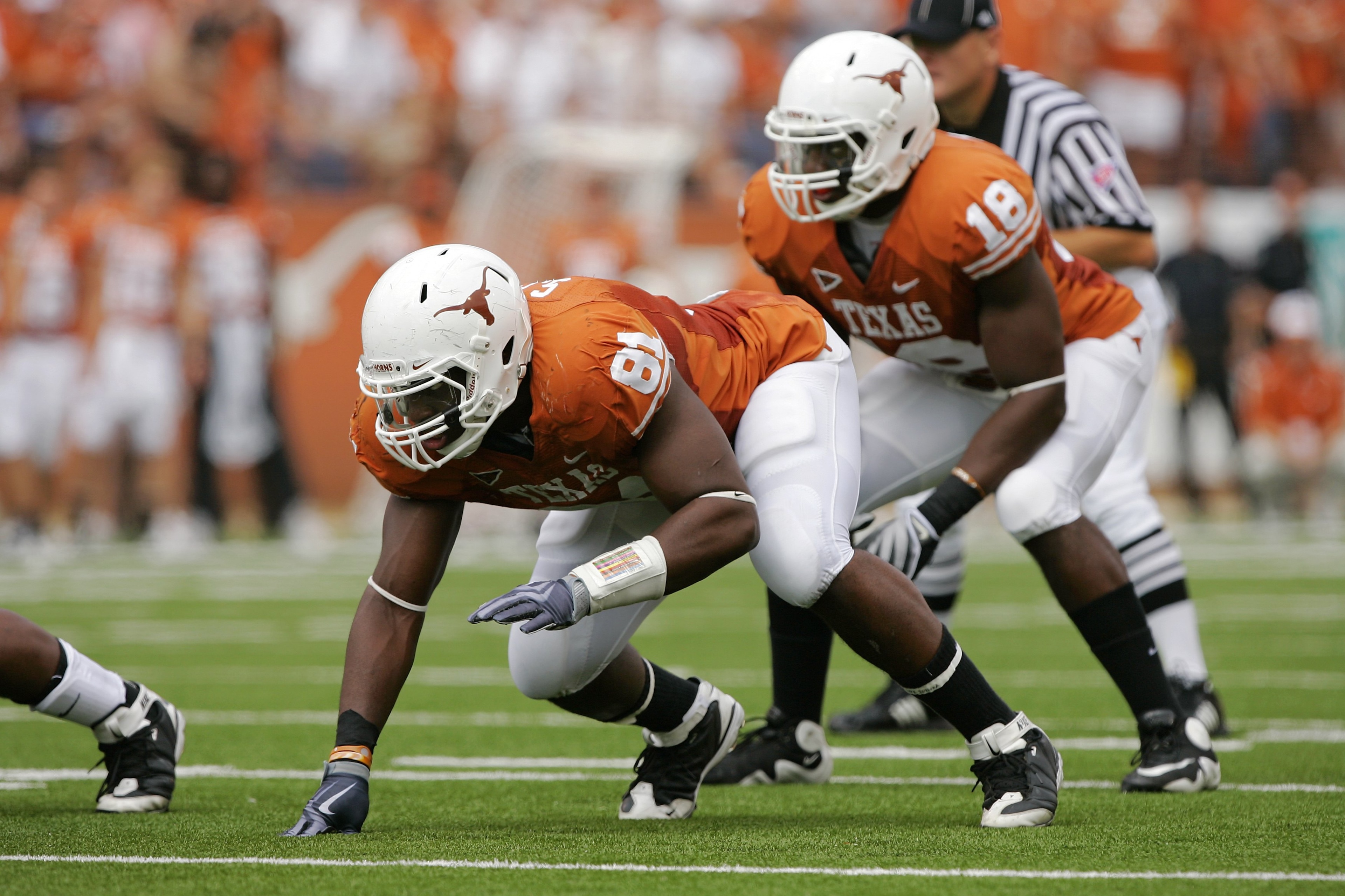 AUSTIN, TX - NOVEMBER 07:  Defensive end Sam Acho #81 and linebacker Emmanuel Acho #18 of the Texas Longhorns line up for a play against the UCF Knights on November 7, 2009 at Darrell K Royal - Texas Memorial Stadium in Austin, Texas.  Texas won 35-3.  (P