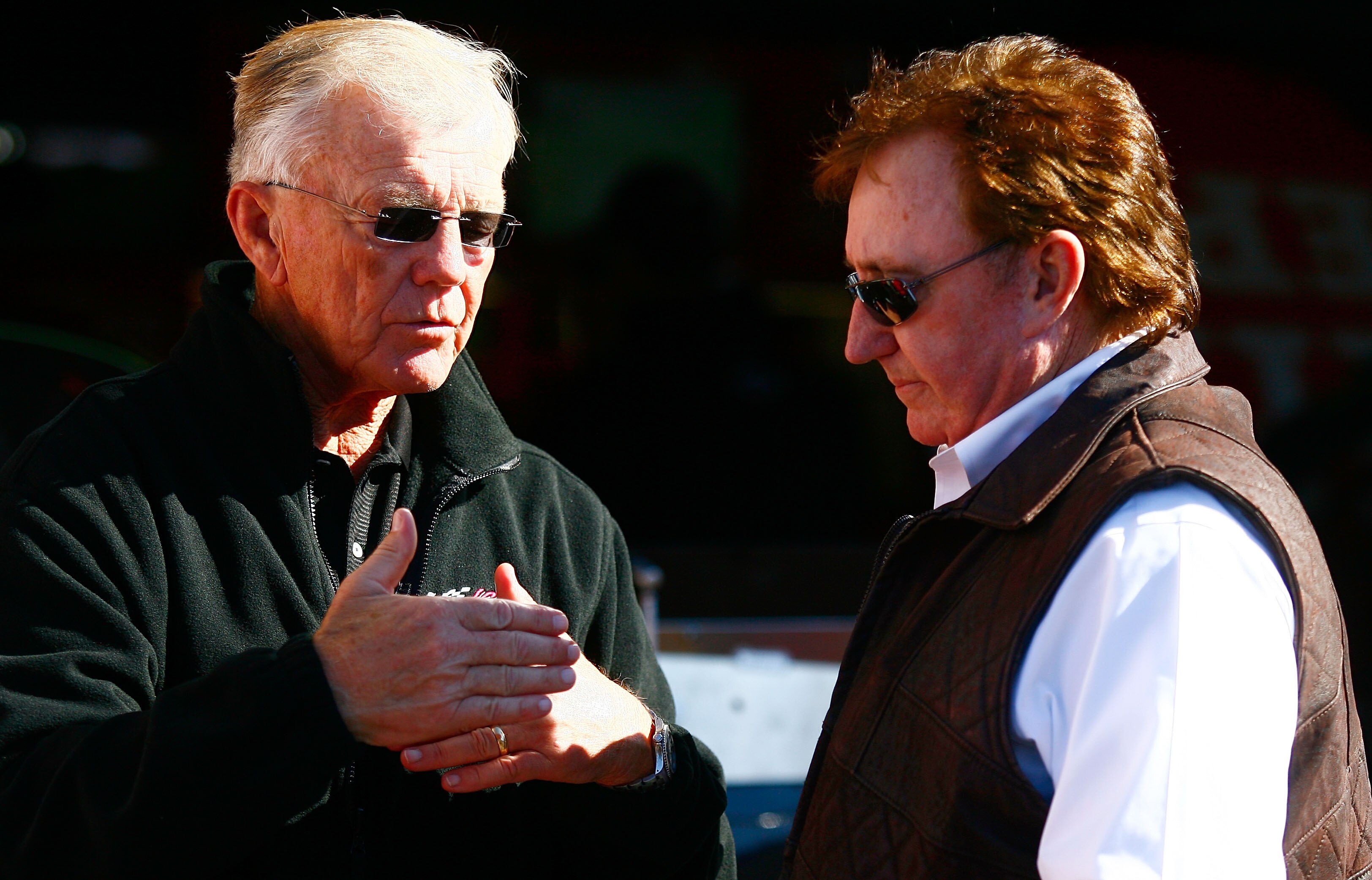 TALLADEGA, AL - OCTOBER 29:  Team owners Joe Gibbs (L) and Richard Childress talk in the garage area during practice for the NASCAR Sprint Cup Series AMP Energy Juice 500 at Talladega Superspeedway on October 29, 2010 in Talladega, Alabama.  (Photo by Jas