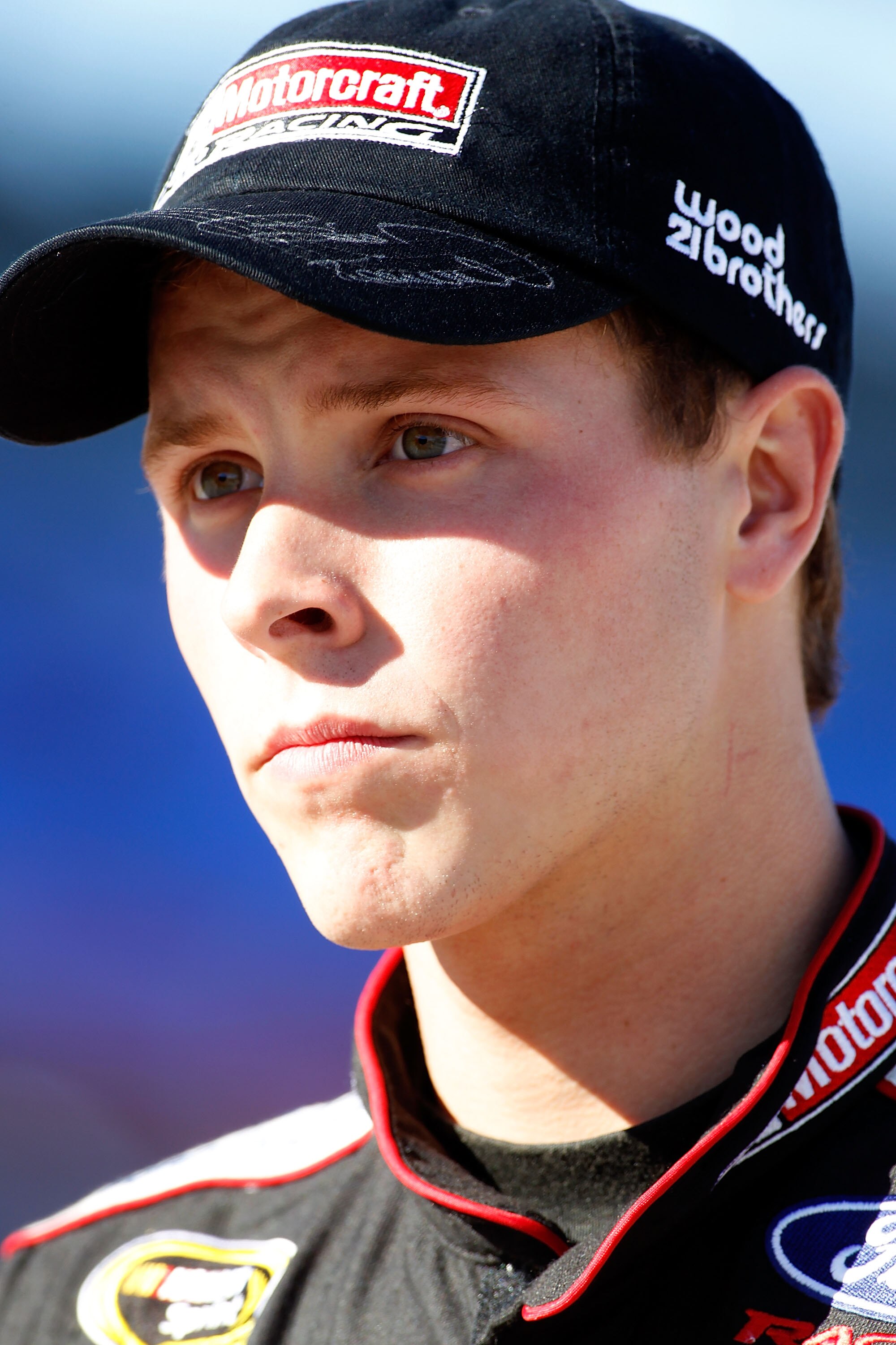 FORT WORTH, TX - NOVEMBER 05:  Trevor Bayne, driver of the #21 Motorcraft/Quick Lane Ford, walks on the grid during qualifying for the NASCAR Sprint Cup Series AAA Texas 500 at Texas Motor Speedway on November 5, 2010 in Fort Worth, Texas.  (Photo by Todd