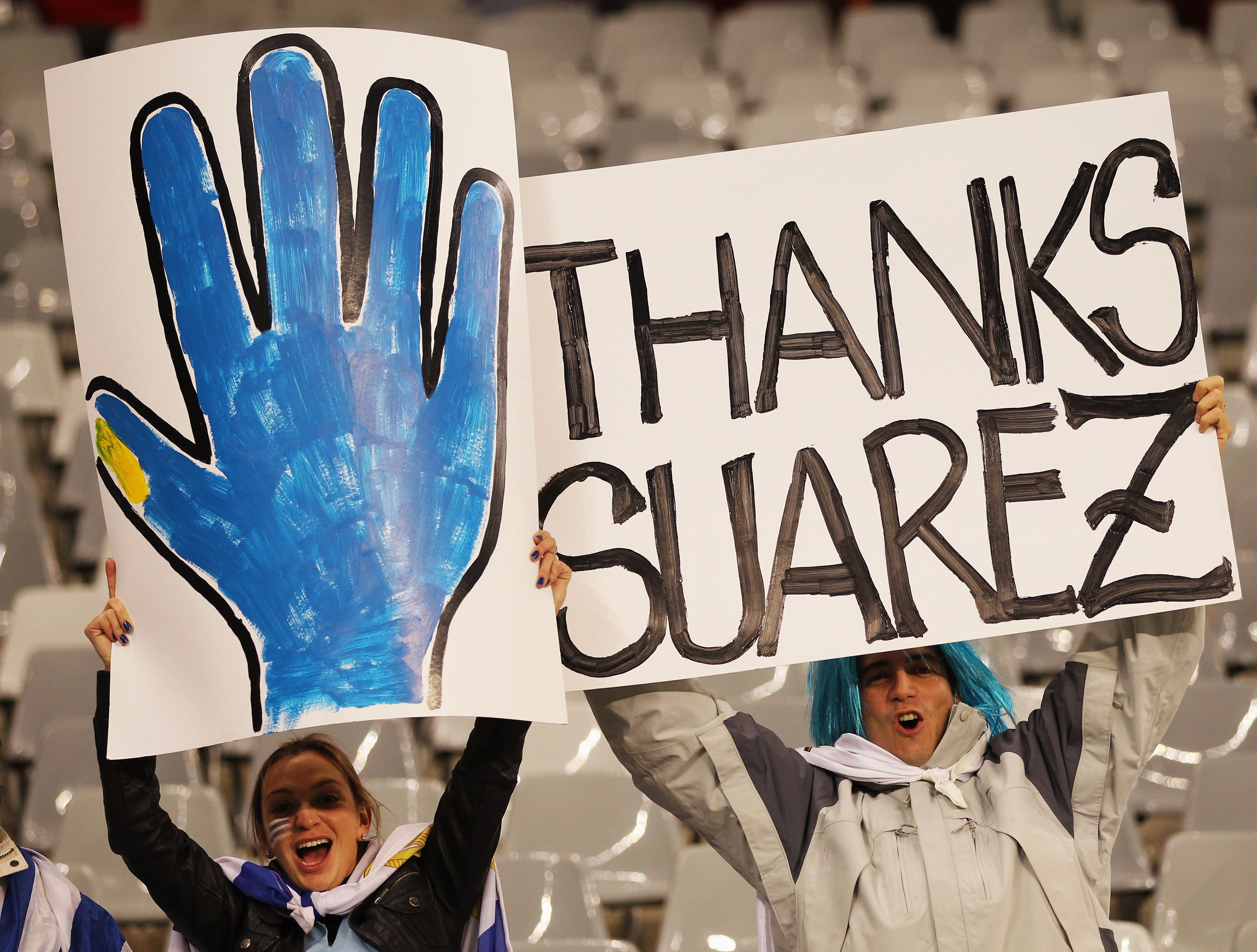 CAPE TOWN, SOUTH AFRICA - JULY 06:  Uruguay fans hold up banners as they enjoy the atmosphere prior to the 2010 FIFA World Cup South Africa Semi Final match between Uruguay and the Netherlands at Green Point Stadium on July 6, 2010 in Cape Town, South Afr