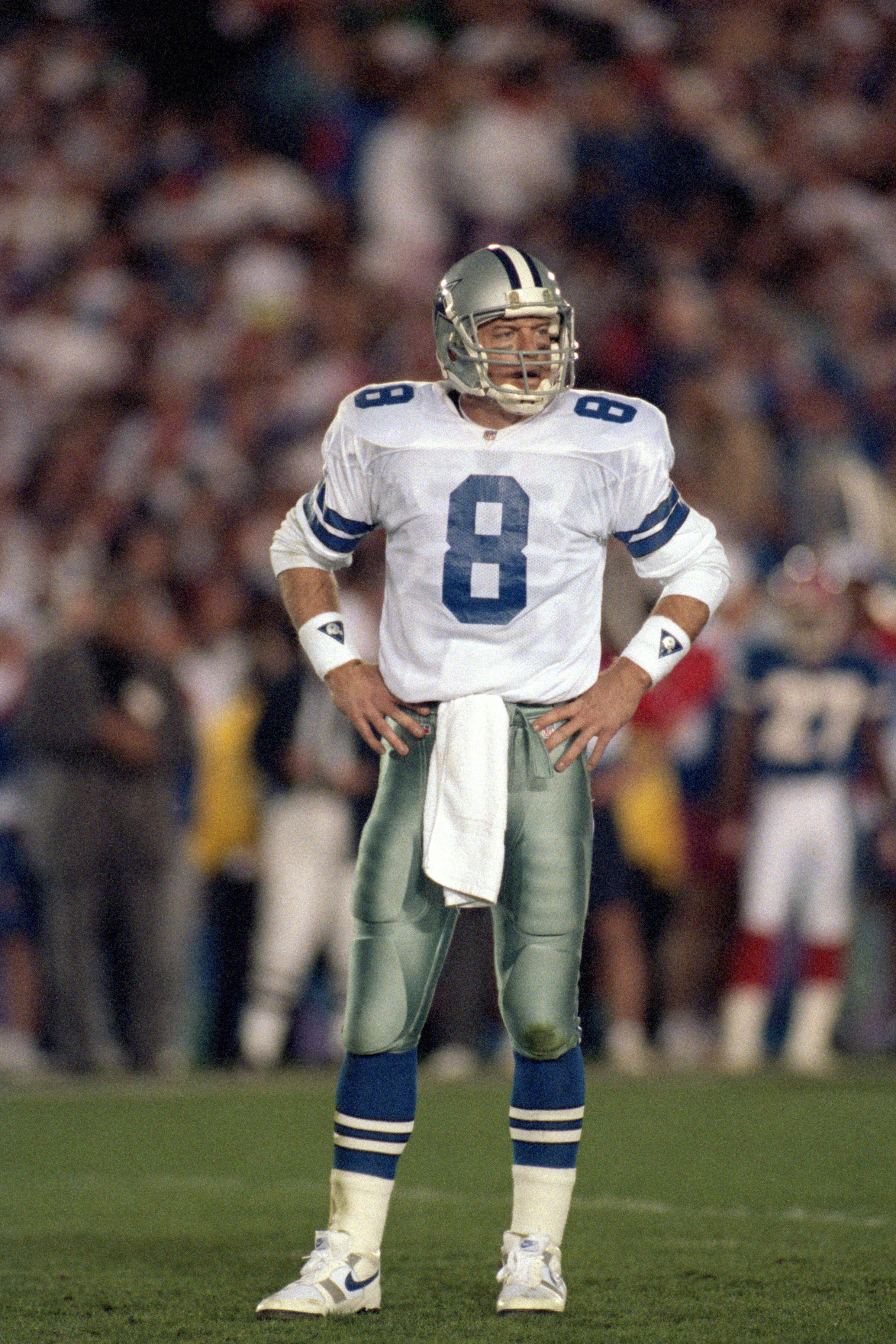 PASADENA, CA - JANUARY 31:  Quarterback Troy Aikman #8 of the Dallas Cowboys looks over to the sidelines during Super Bowl XXVII against the Buffalo Bills at the Rose Bowl on January 31, 1993 in Pasadena, California.  The Cowboys won 52-17.  (Photo by Geo