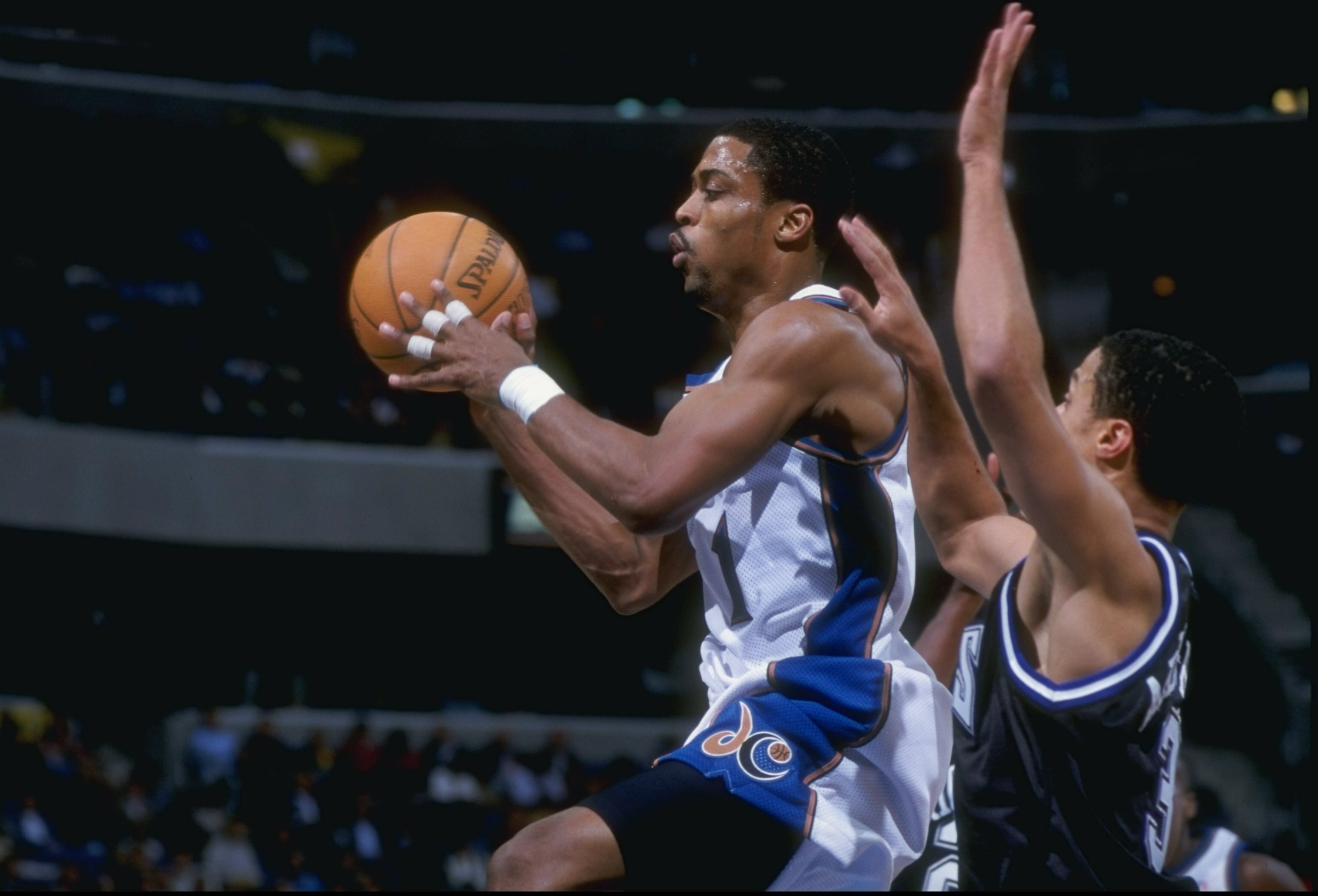 4 Dec 1997:  Guard Mahmoud Abdul-Rauf of the Denver Nuggets tries to block guard Rod Strickland of the Washington Wizards during a game at the MCI Center in Washington D.C.  The Wizards won the game 118-96. Mandatory Credit: Doug Pensinger  /Allsport