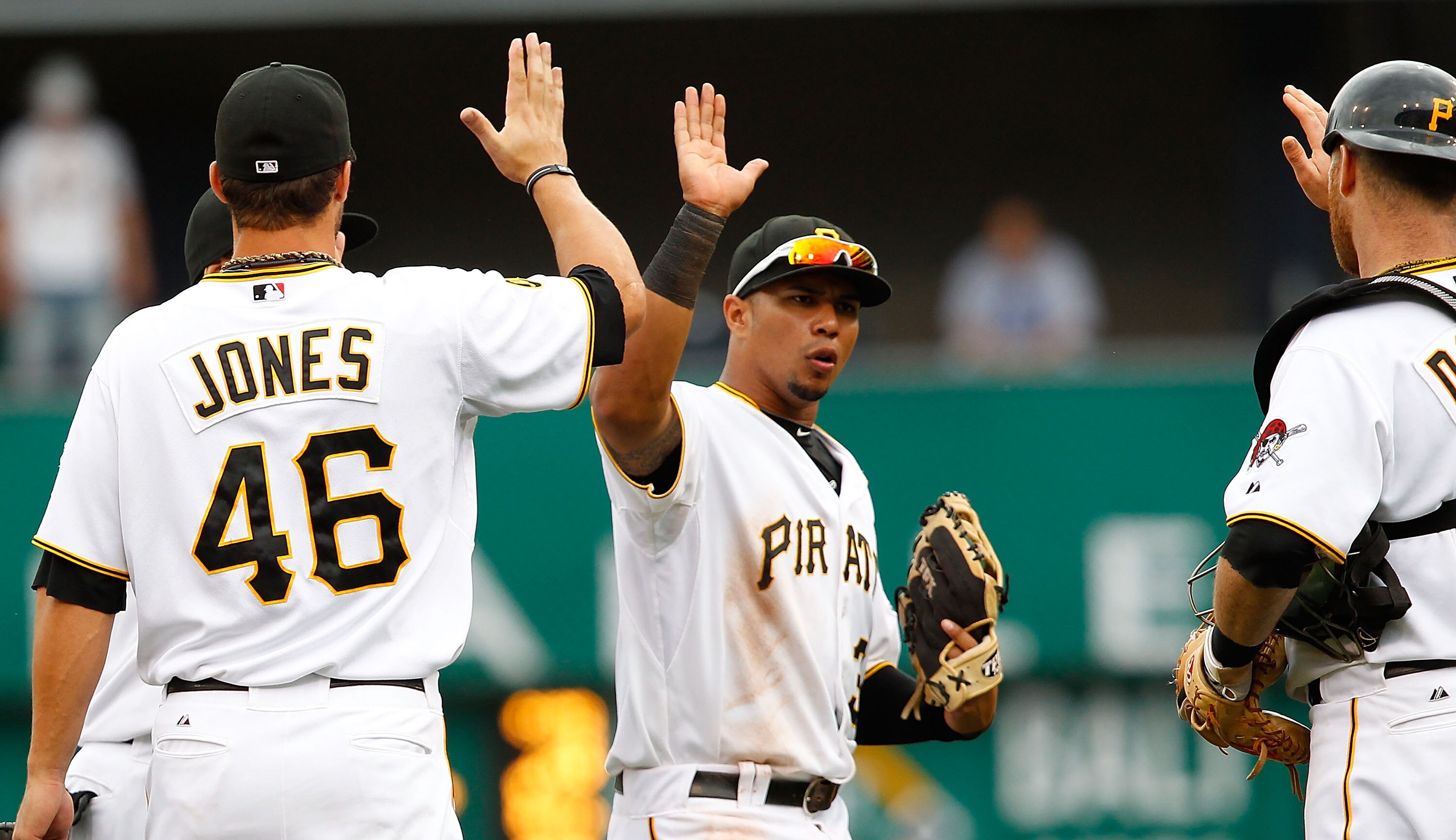 PITTSBURGH - SEPTEMBER 06:  Jose Tabata #31 congratulates teammates Garrett Jones #46 and Ryan Doumit #41 after their 3-1 win against the Atlanta Braves of the Pittsburgh Pirates during the game on September 6, 2010 at PNC Park in Pittsburgh, Pennsylvania