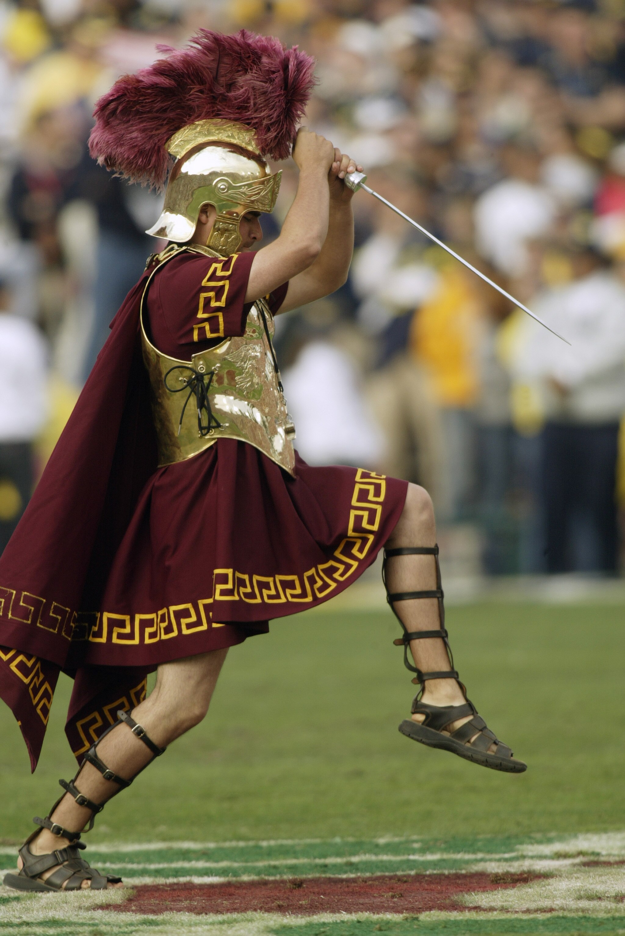 PASADENA, CA - JANUARY 1:  Tommy Trojan, mascot of the USC Trojans entertains the crowd during an intermission in the 2004 Rose Bowl game against the Michigan Wolverines on January 1, 2004 at the Rose Bowl in Pasadena, California. USC defeated Michigan 28