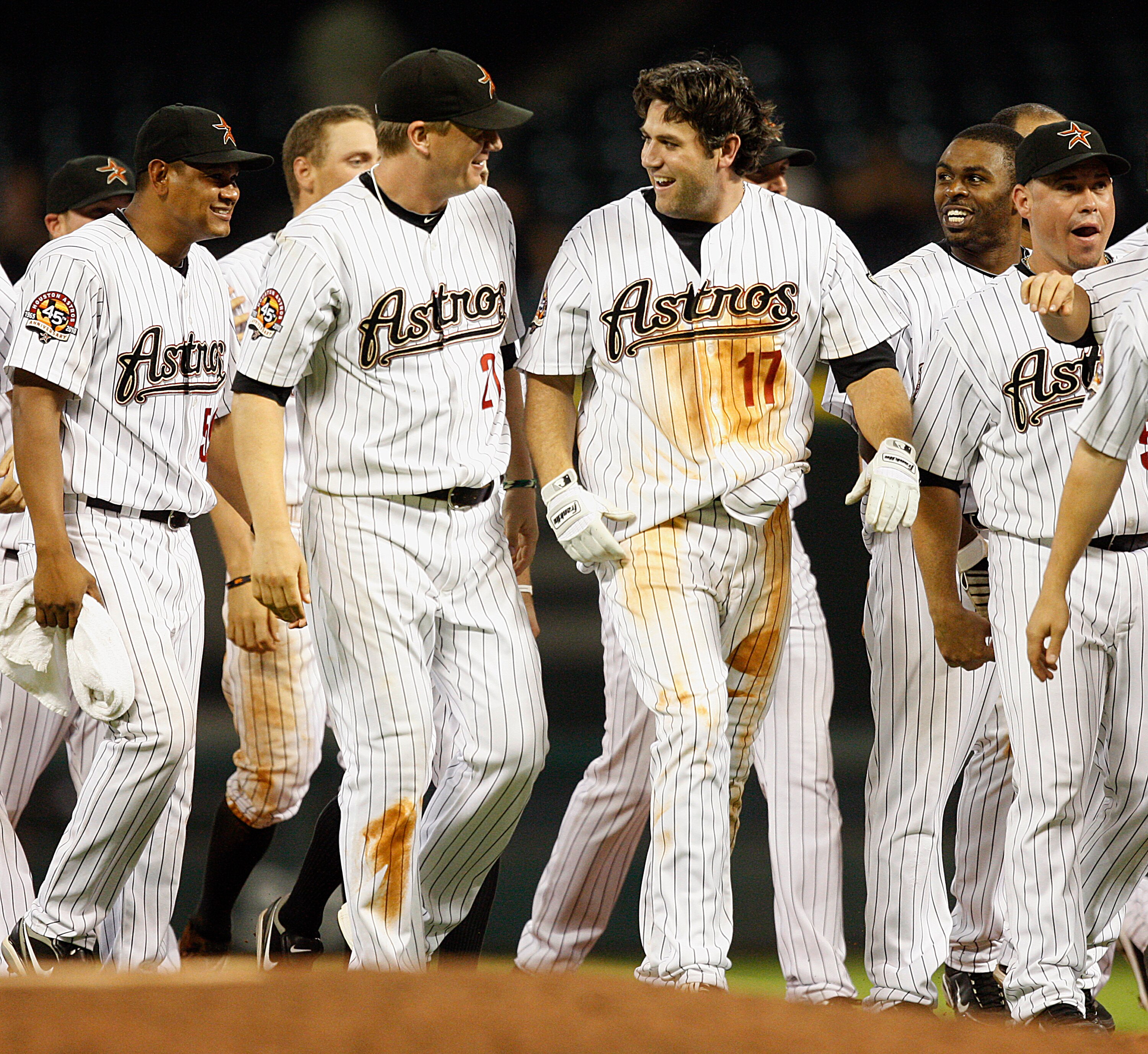 HOUSTON - JUNE 01:  Lance Berkman #17 of the Houston Astros celebrates with Geoff Blum after his game winning hit in the bottom of the ninth against the Washington Nationals at Minute Maid Park on June 1, 2010 in Houston, Texas.  (Photo by Bob Levey/Getty